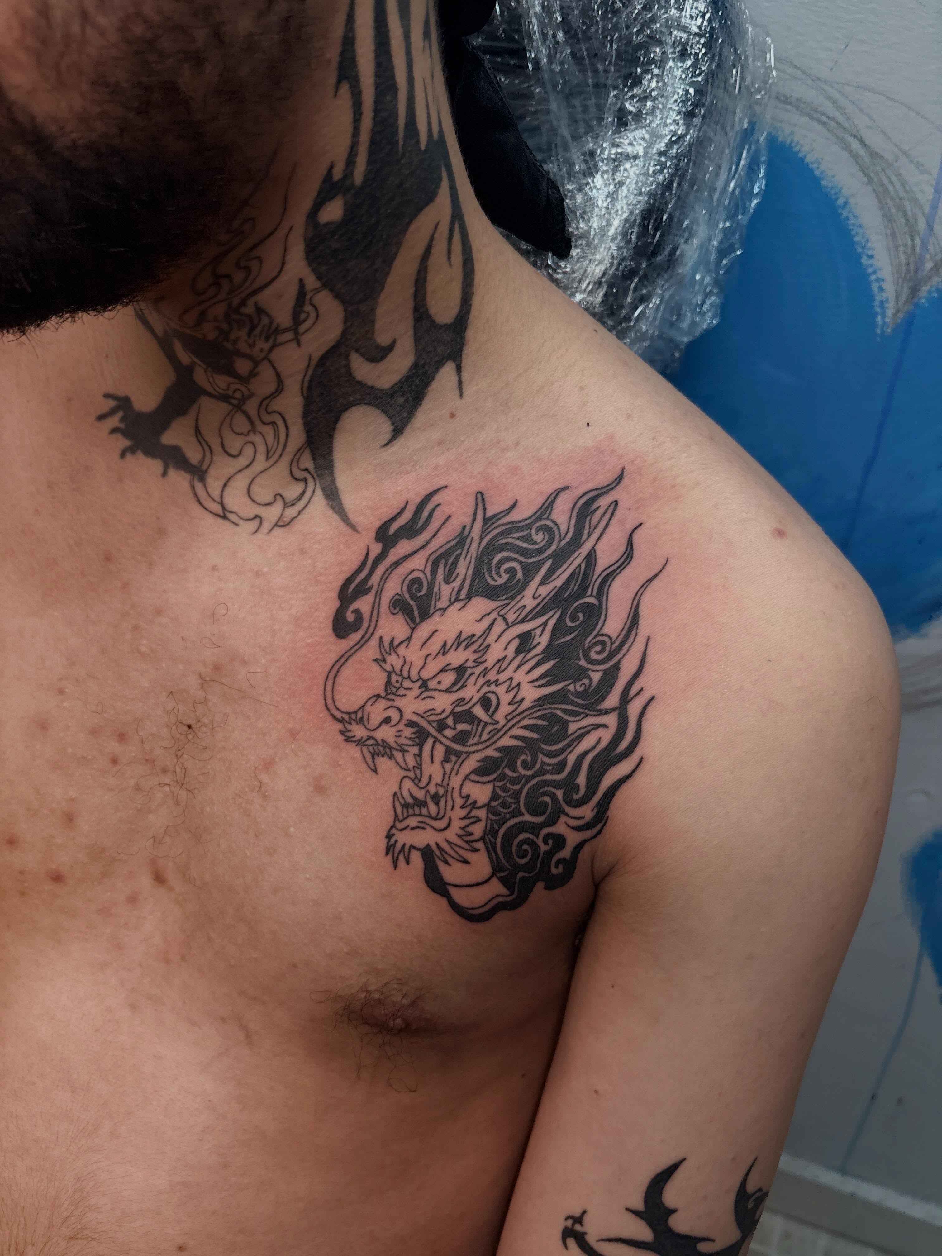 Dragon black and grey tattoo on the chest by 𝓚𝓪𝓻𝓶𝓪💫