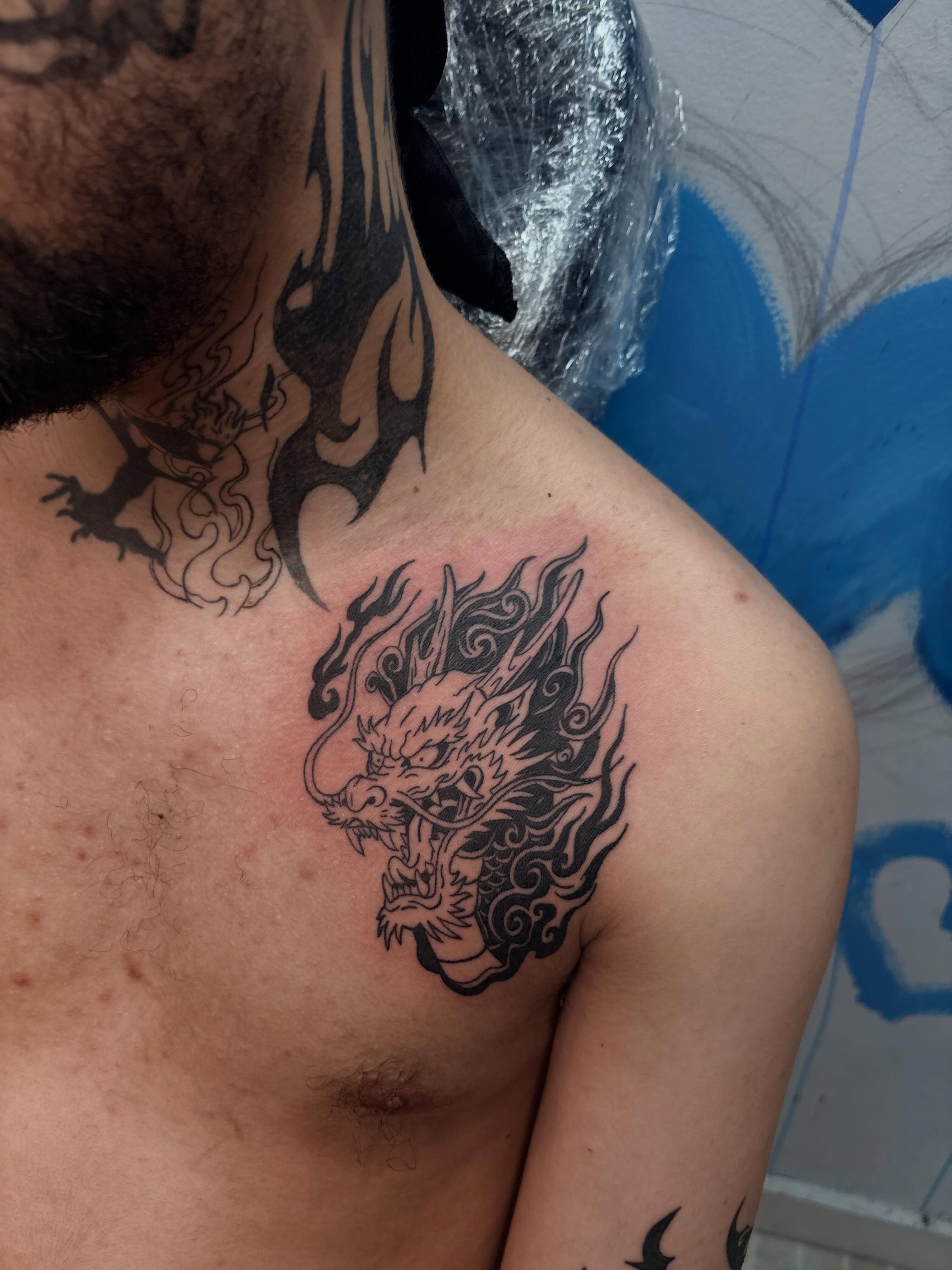 Dragon black and grey tattoo on the shoulder by 𝓚𝓪𝓻𝓶𝓪💫