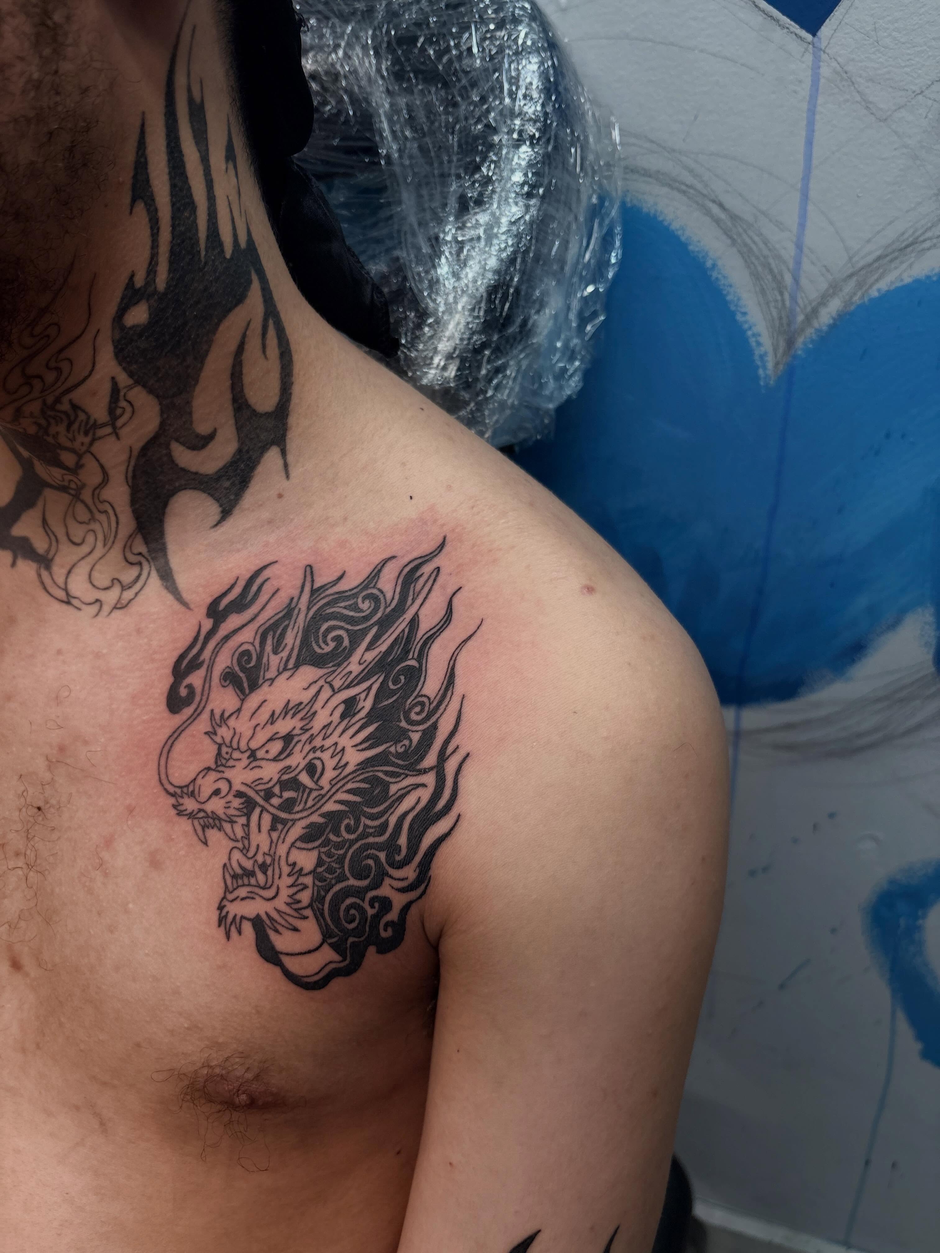Dragon black and grey tattoo on the shoulder by 𝓚𝓪𝓻𝓶𝓪💫