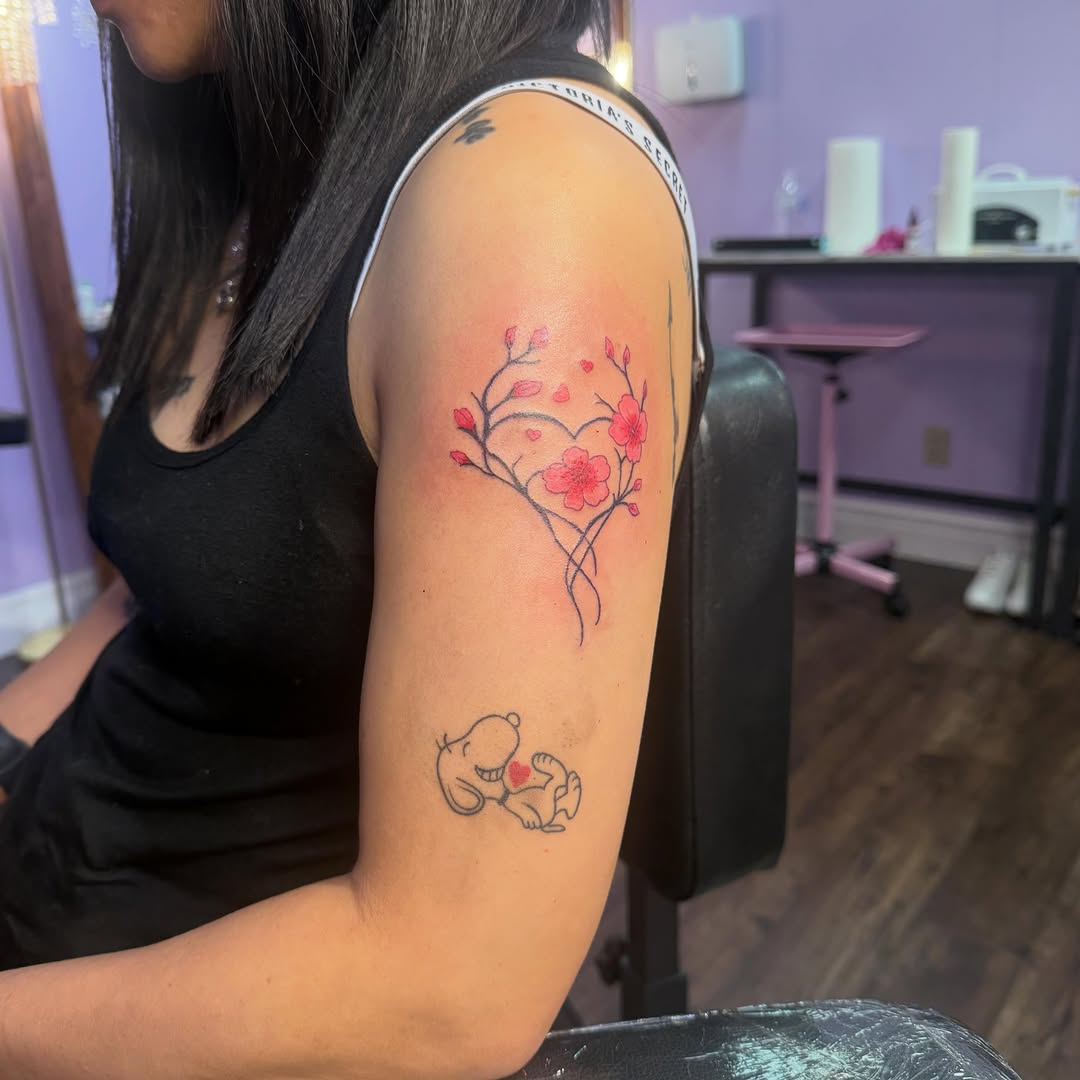 Heart with cherry blossoms and Snoopy tattoo on the forearm by Jay