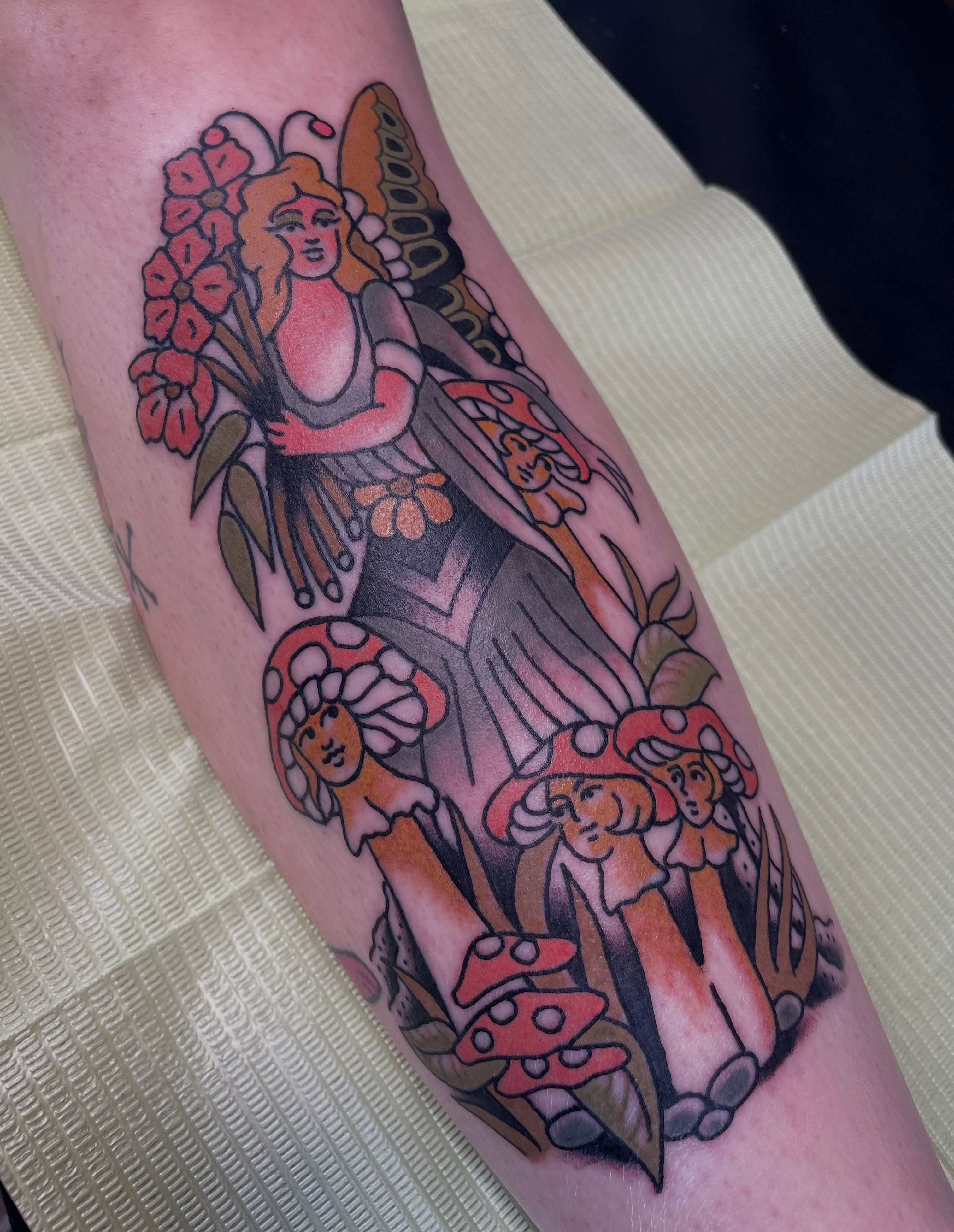 Woman with mushrooms American traditional tattoo on the forearm by @pizzabref
