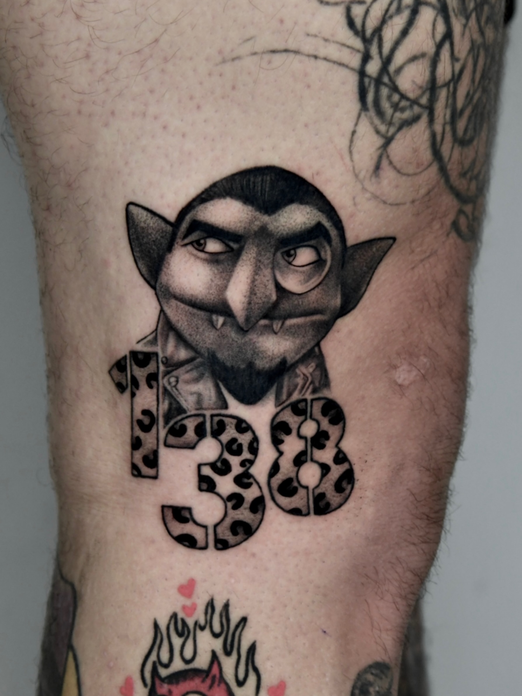 Elf-like creature with leopard print realism tattoo on the forearm by Milk Tattoos 🇸🇻🇪🇸