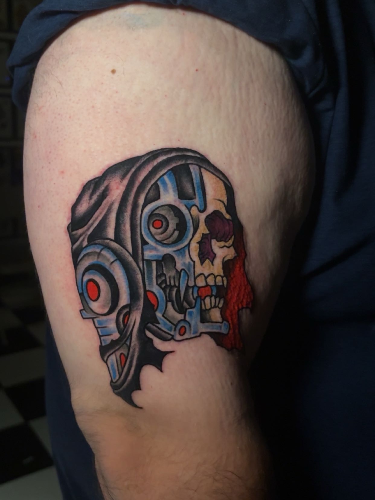 Cyborg skull American traditional tattoo on the thigh by Chris Prince Jr., Miamisburg, Ohio