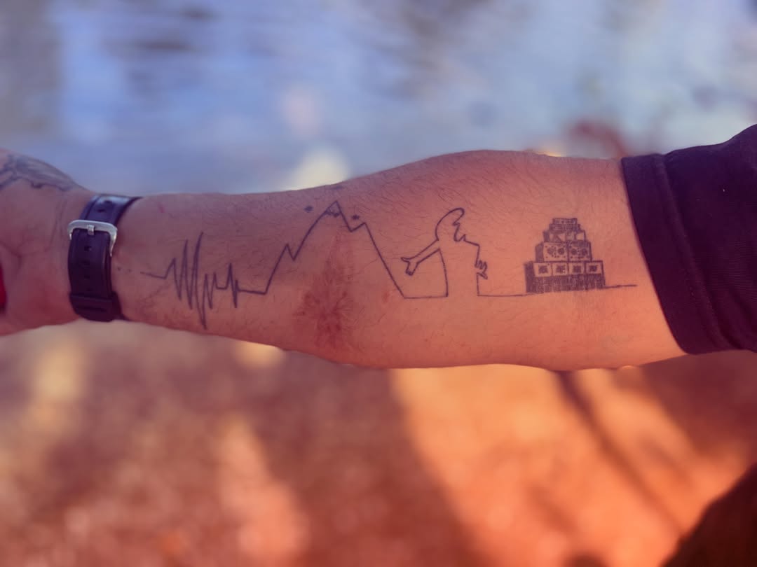 Heart rate line, mountain, person, pyramid minimalist tattoo on the forearm by La Main Bleue