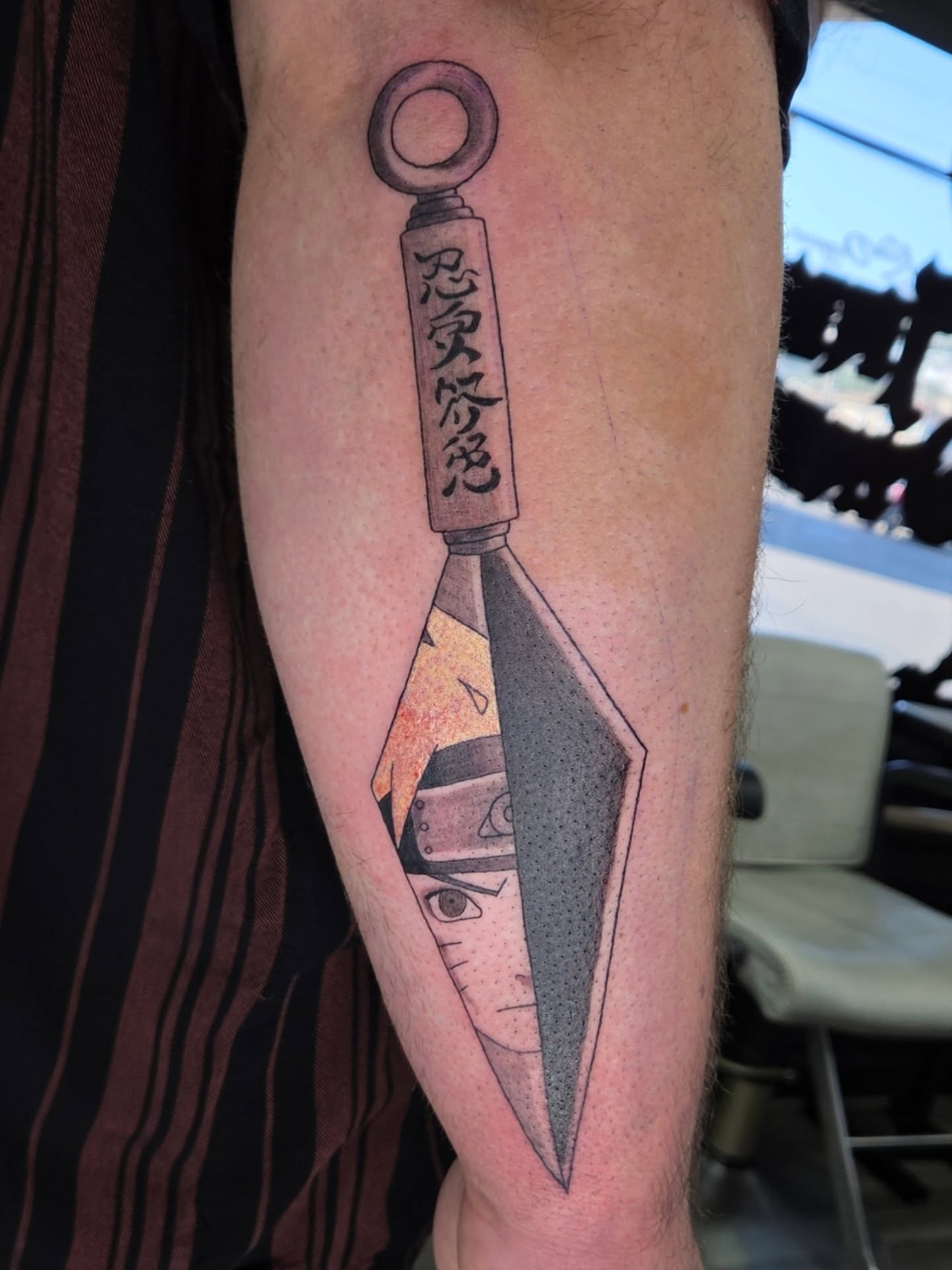 Throwing star with ninja dotwork tattoo on the forearm by Jessica Duggan