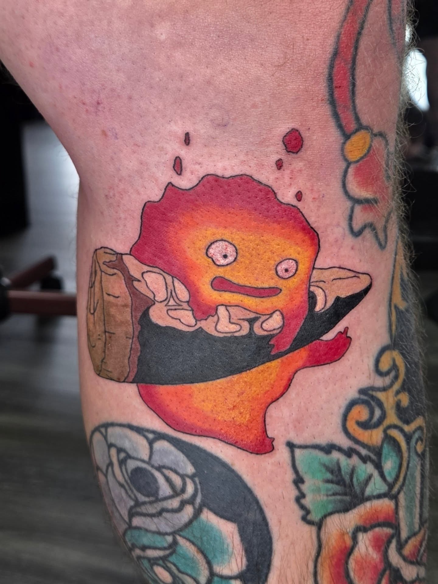 Fire demon American traditional tattoo on the thigh by Jessica Duggan
