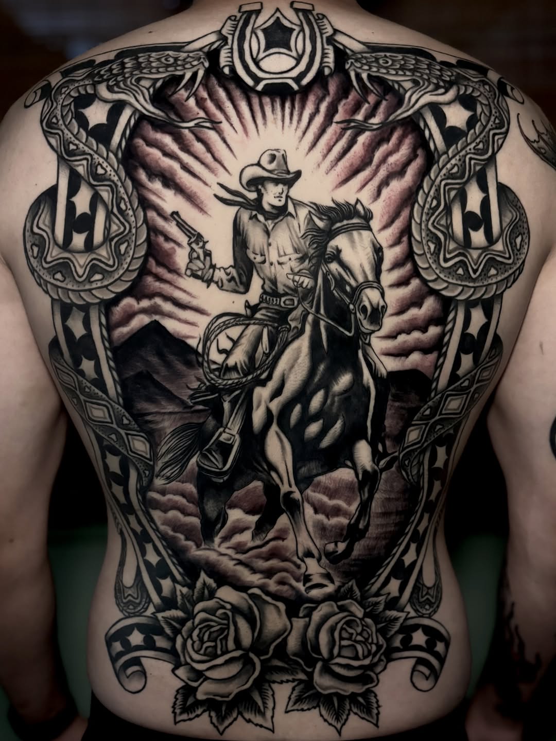 Cowboy on horseback Chicano tattoo on the back by Weston Imhoff