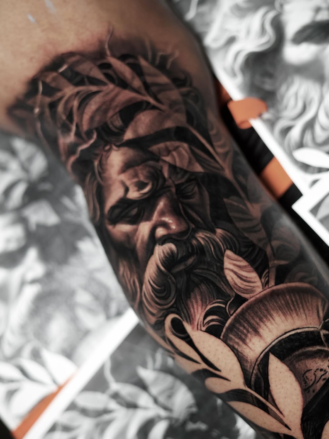 Bearded man with laurel wreath realism tattoo on the forearm by Bapone