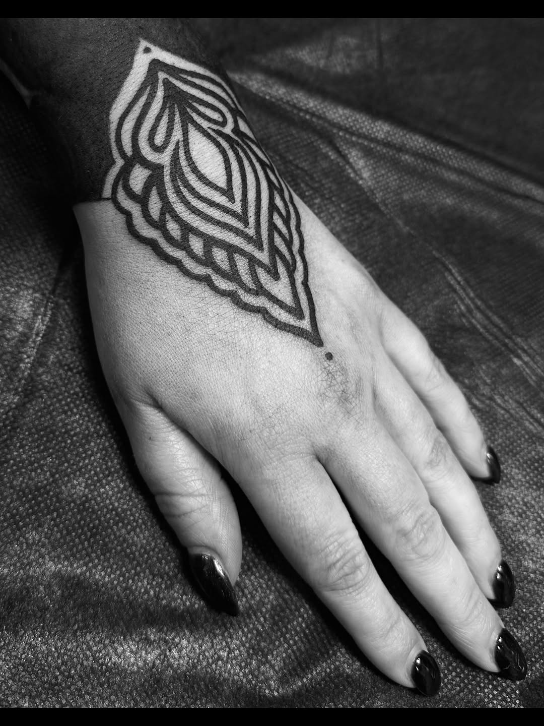 Ornamental pattern on wrist and hand dotwork tattoo on the hand by Ciera Farni, Murray, Utah