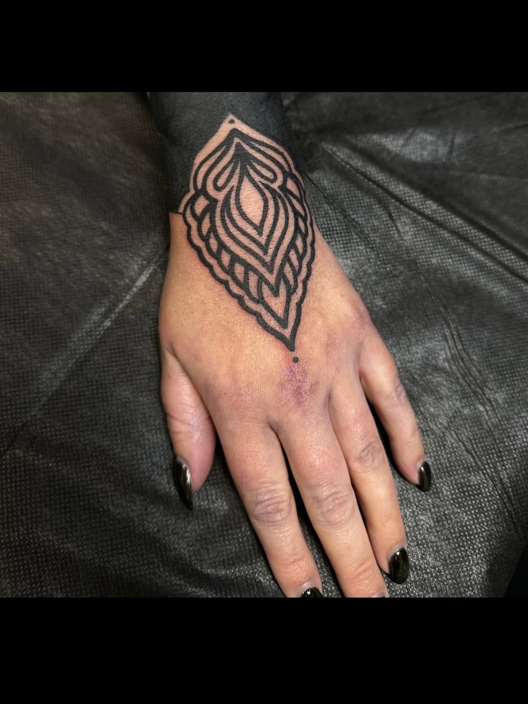 Ornamental pattern on hand and wrist dotwork tattoo on the hand by Ciera Farni, Murray, Utah