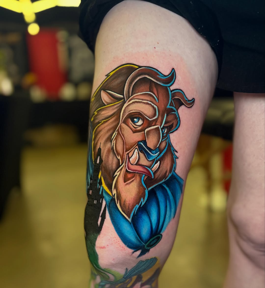 Lion American traditional tattoo on the thigh by Rachel Sellers