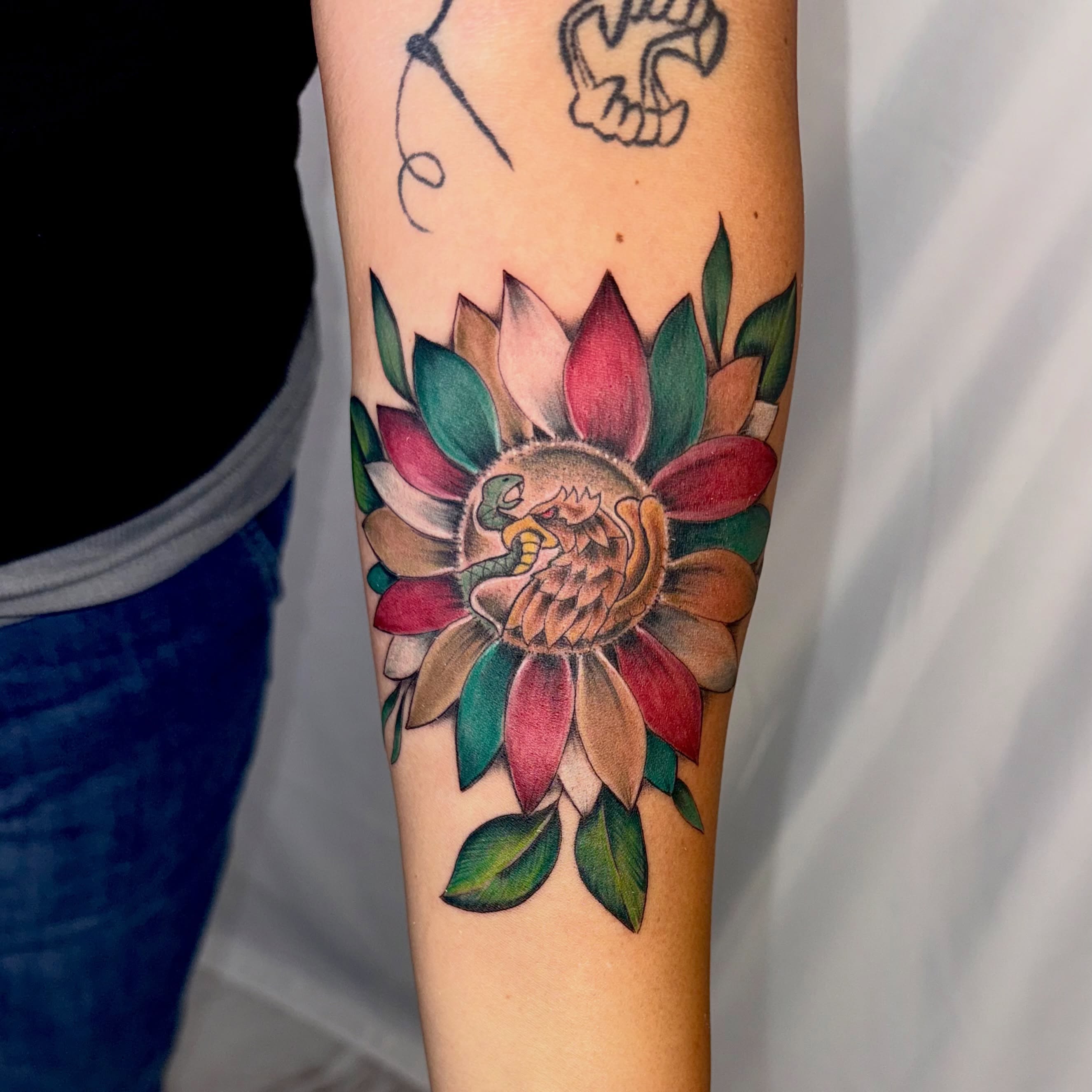 Flower new school tattoo on the forearm by Jerry Thomas