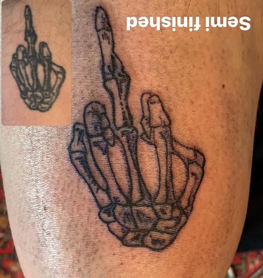 Skeleton middle finger realism tattoo on the forearm by Addison Bruce