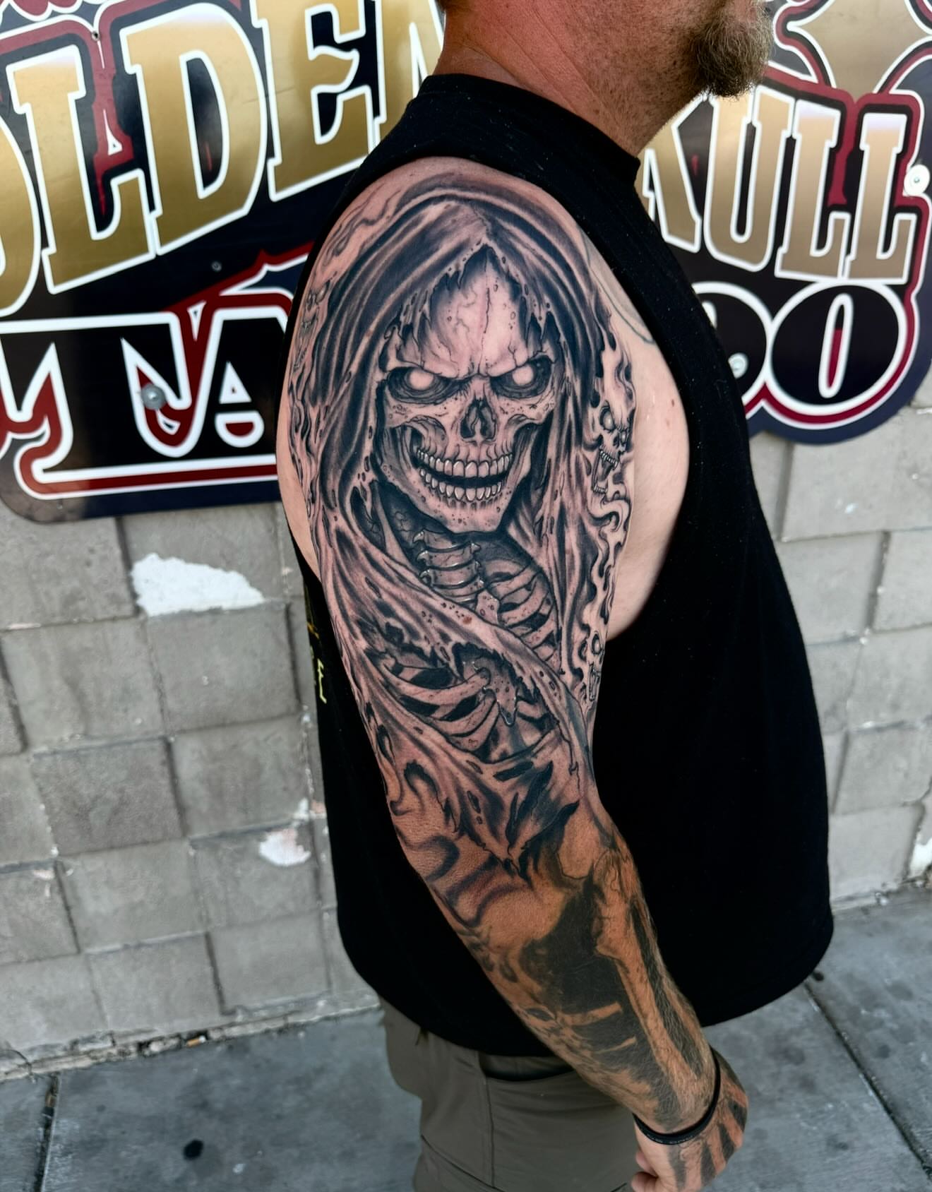 Grim reaper realism tattoo on the upper arm by Gary Chase