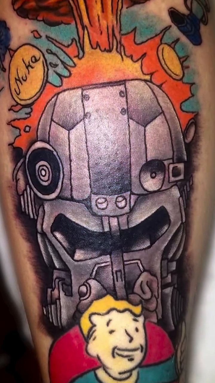 Robo-brain with Vault Boy tattoo on the upper arm by Tattoos by Dan Hatcher Carr, Parma, Ohio