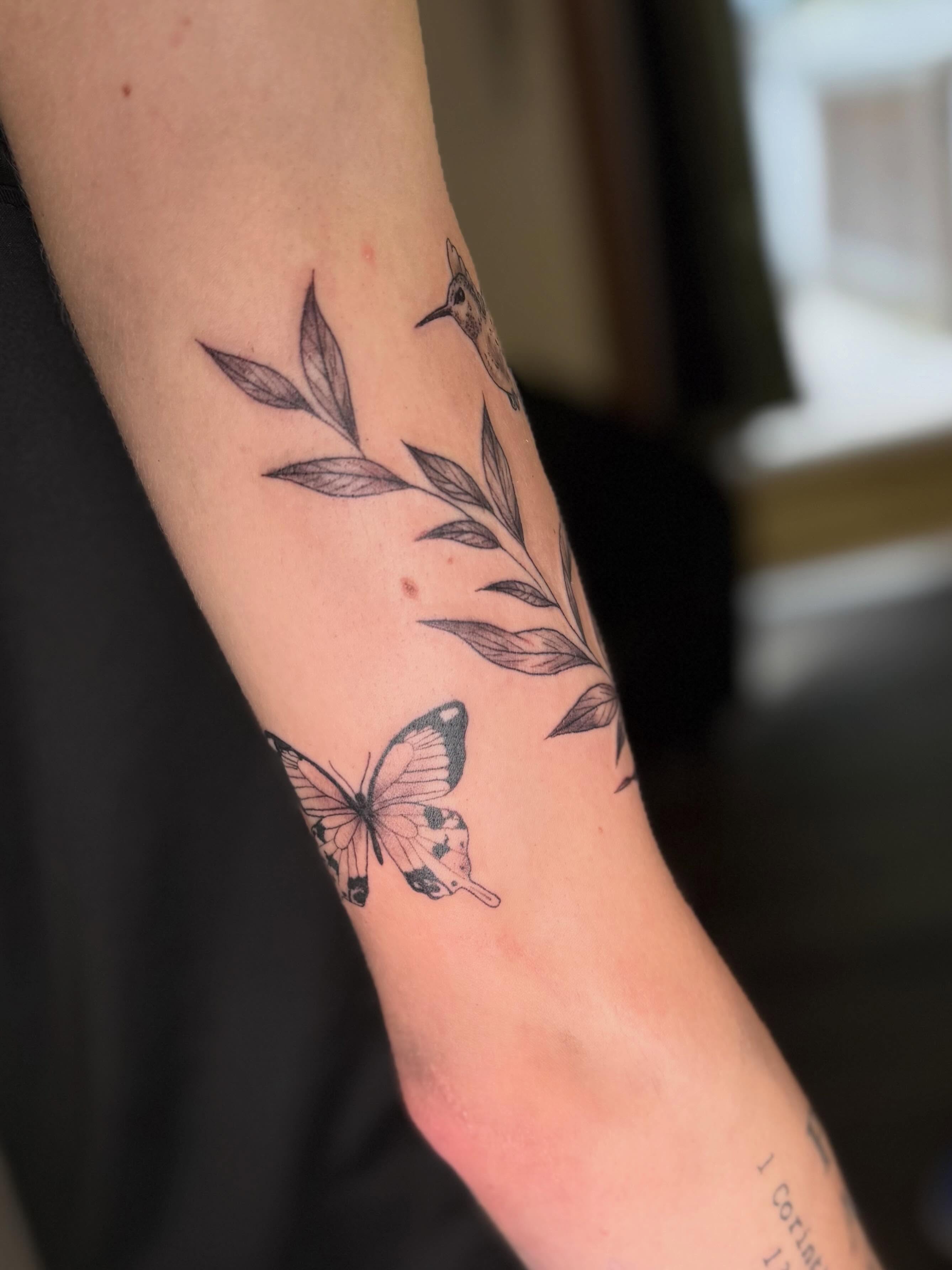 Butterfly and leaves black and grey tattoo on the forearm by βπ¬π―π’πΆ