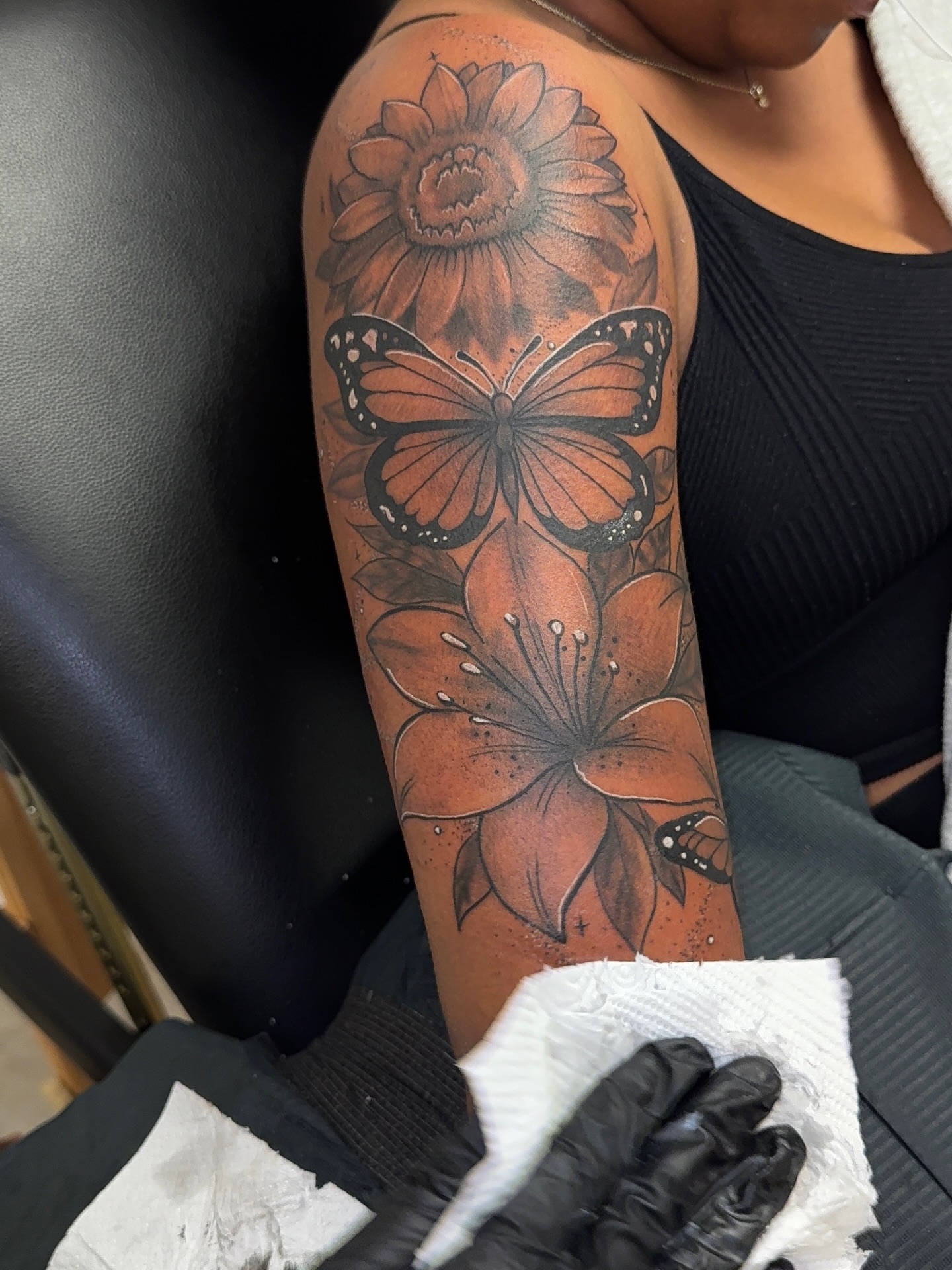Sunflower and butterfly realism tattoo on the forearm by XoticTherapy, Las Vegas, Nevada