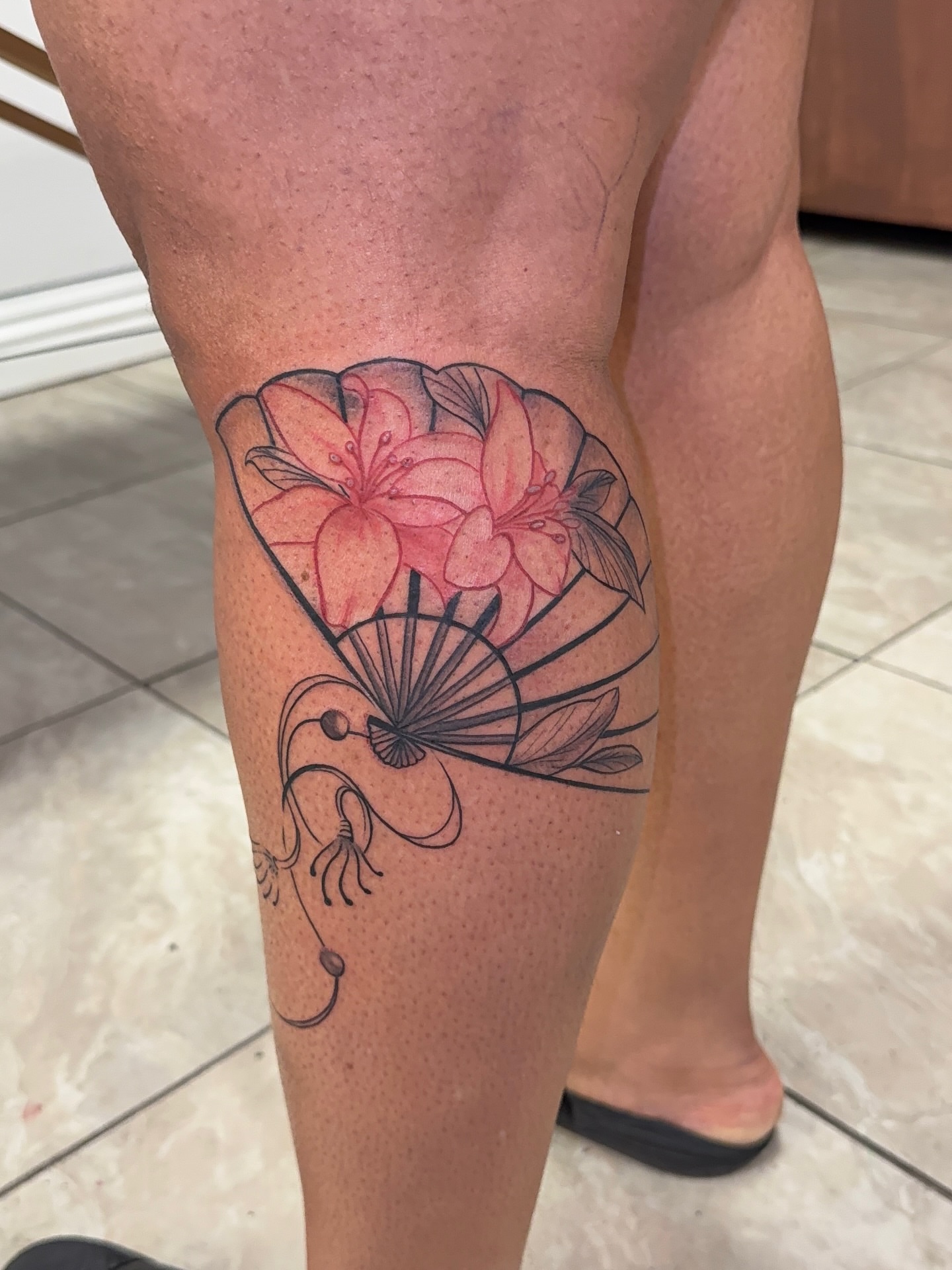 Flower and fan dotwork tattoo on the thigh by XoticTherapy, Las Vegas, Nevada