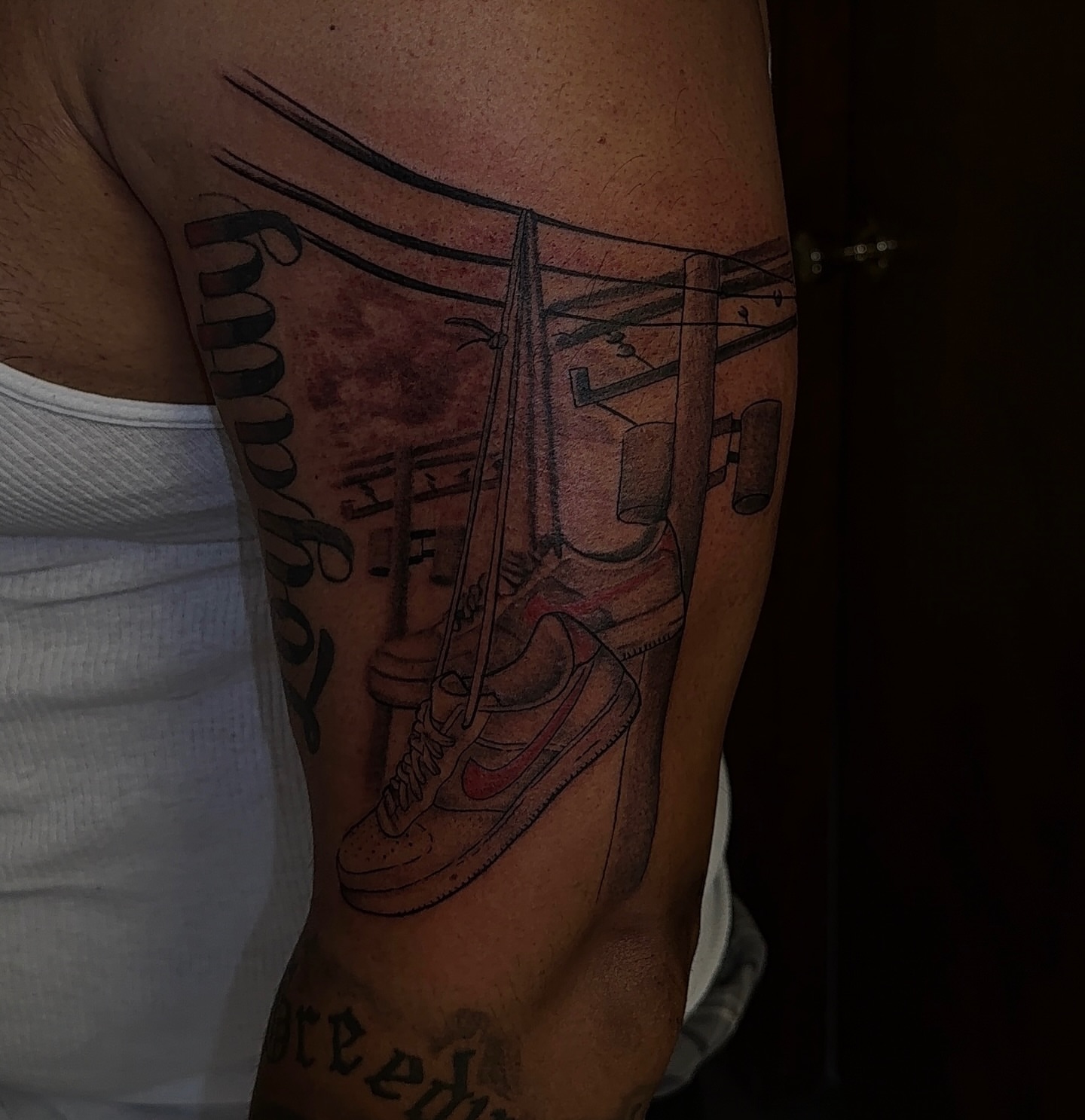 Sneakers and gym equipment realism tattoo on the forearm by XoticTherapy, Las Vegas, Nevada
