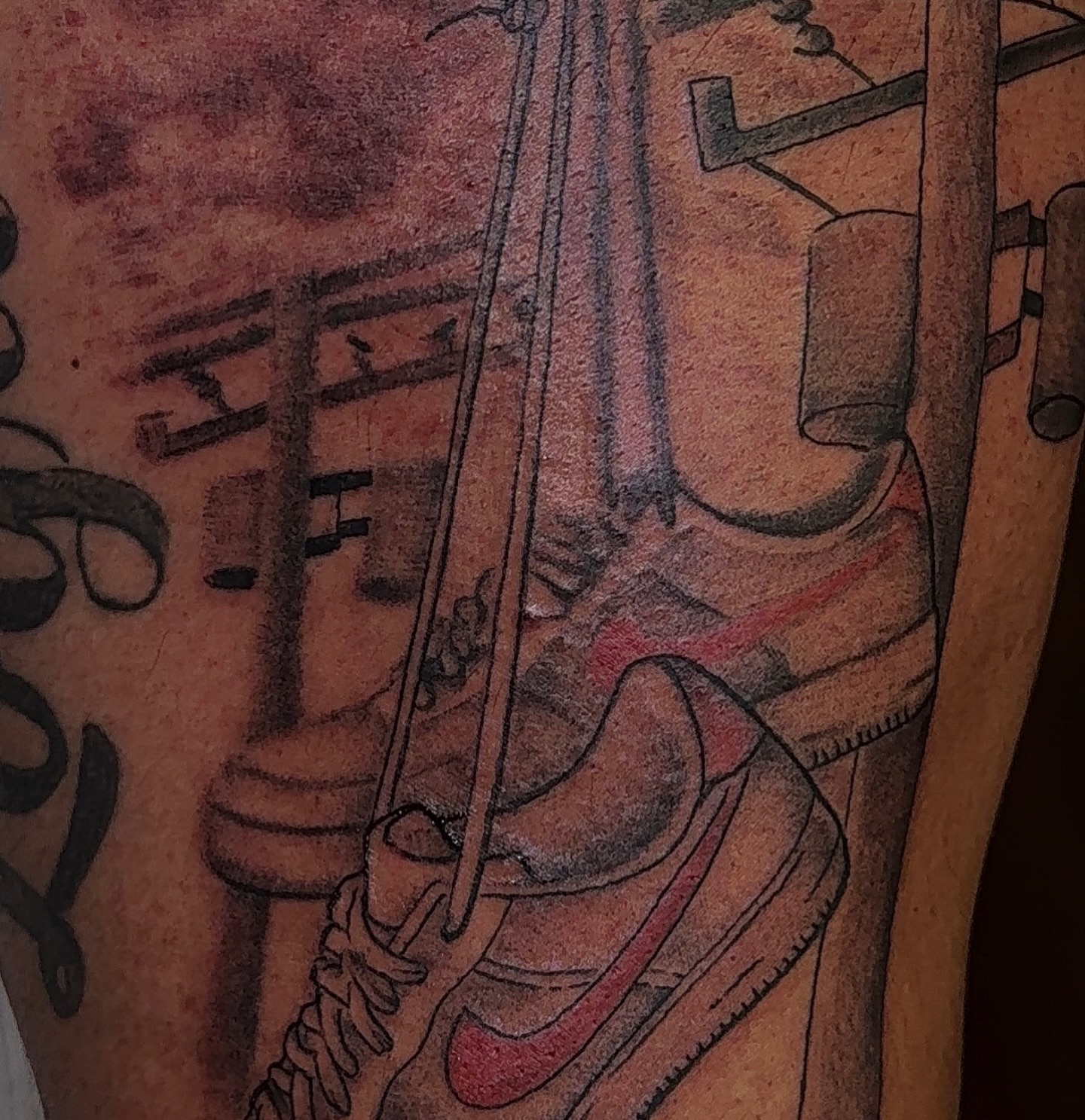 Sneaker and violin realism tattoo on the forearm by XoticTherapy, Las Vegas, Nevada