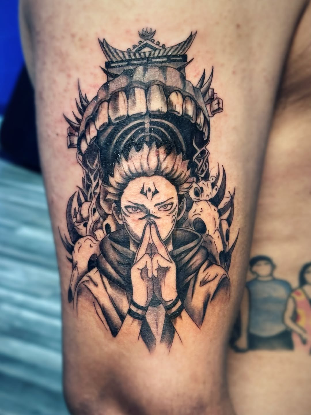 Anime character with crown and skulls anime tattoo on the thigh by Kate
