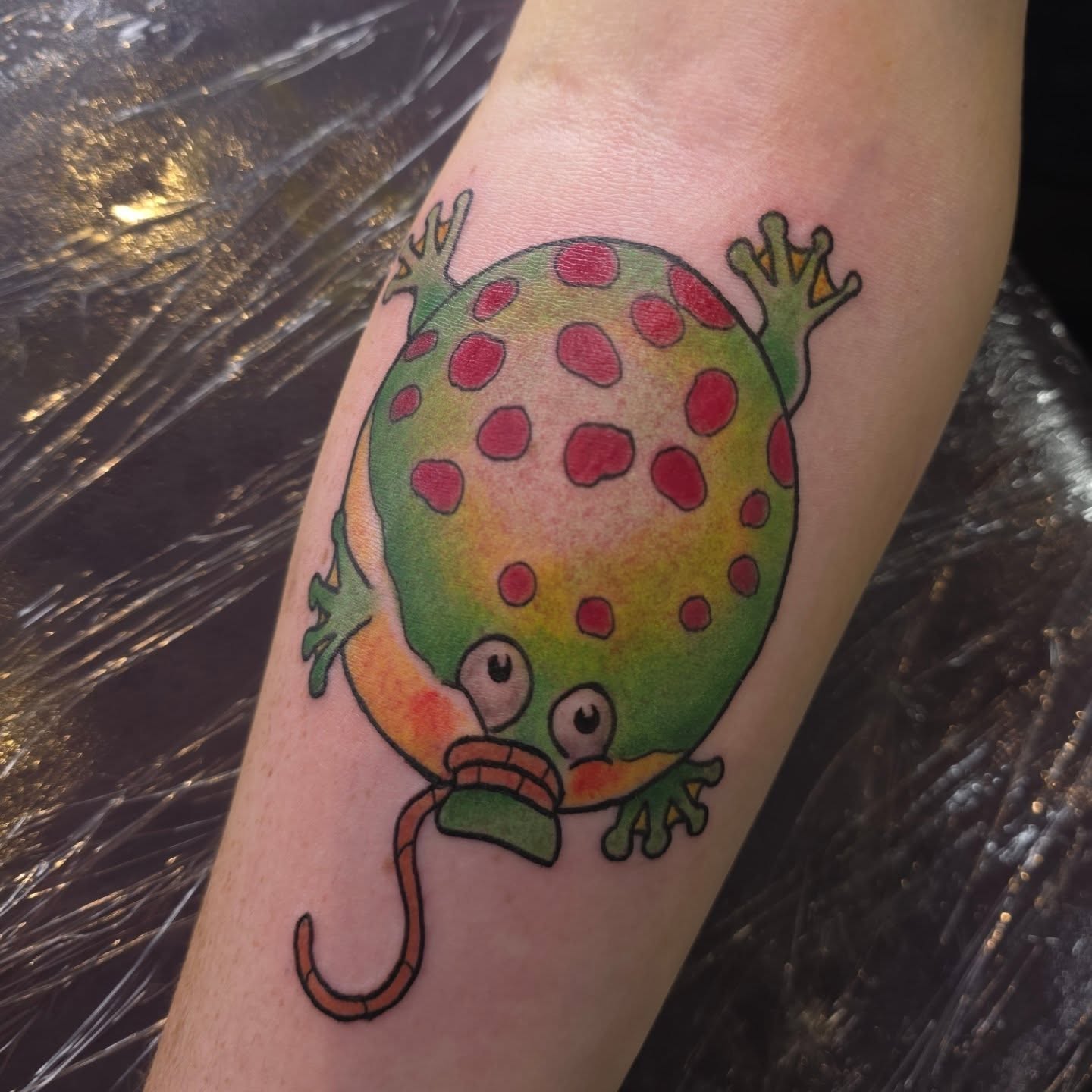 Frog dotwork tattoo on the forearm by Kayla Williams