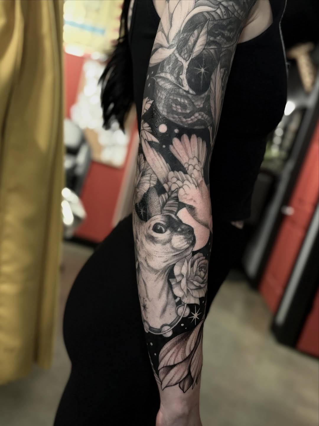 Deer head with celestial elements realism tattoo on the forearm by Amy Oliver