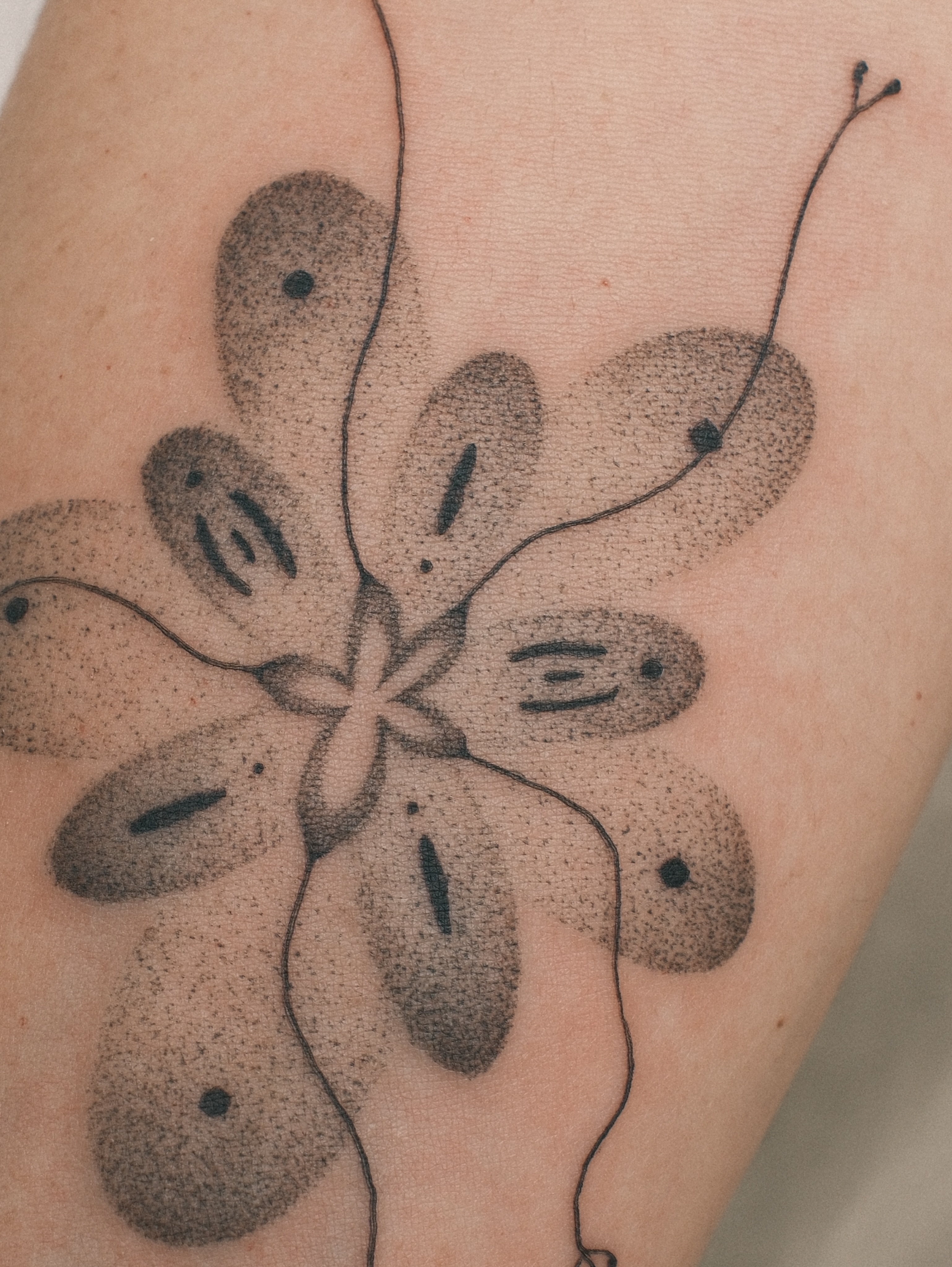 Abstract flower dotwork tattoo on the forearm by Diana ๐ซ