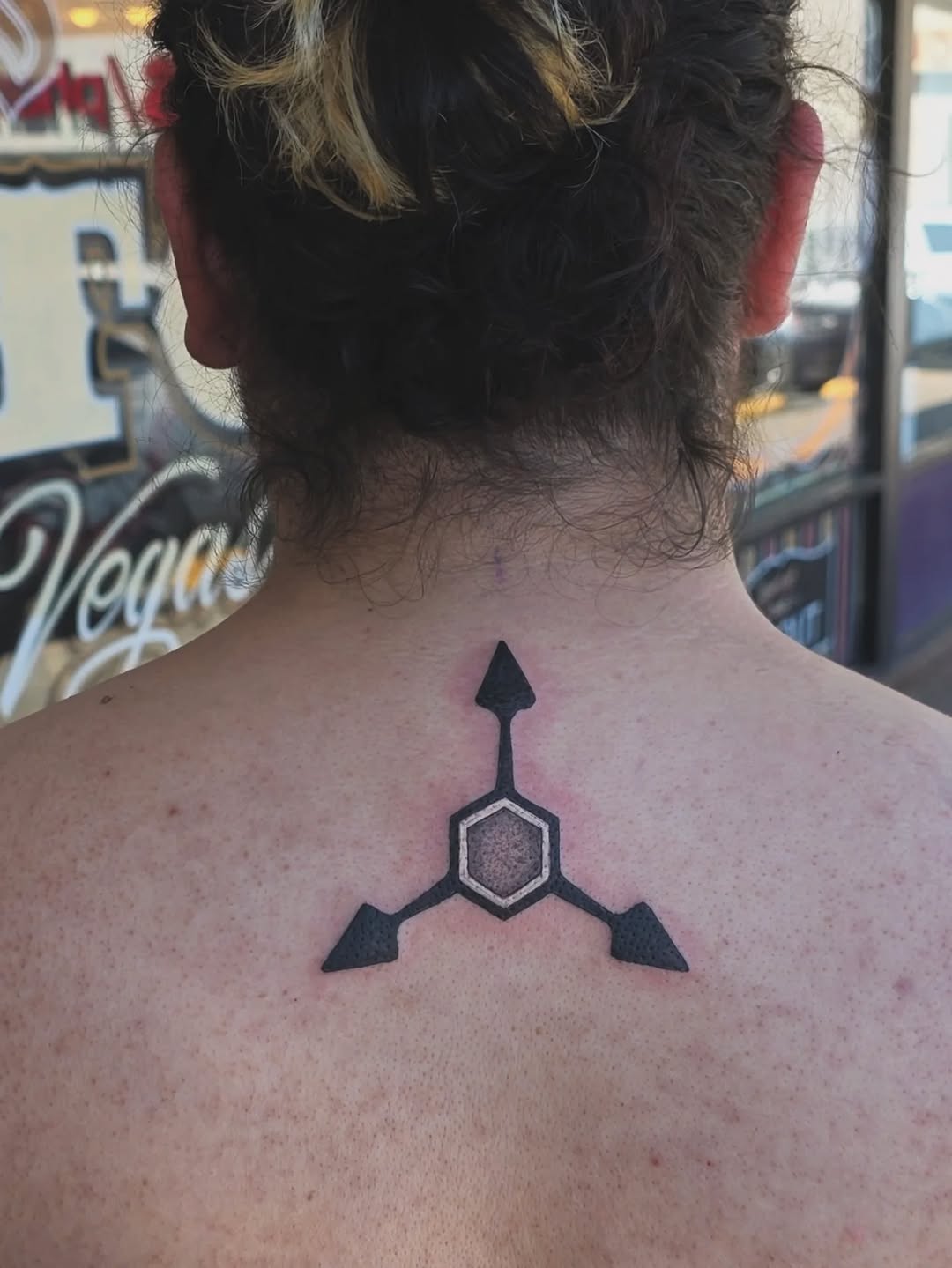 Geometric symbol tribal tattoo on the back by Cielle