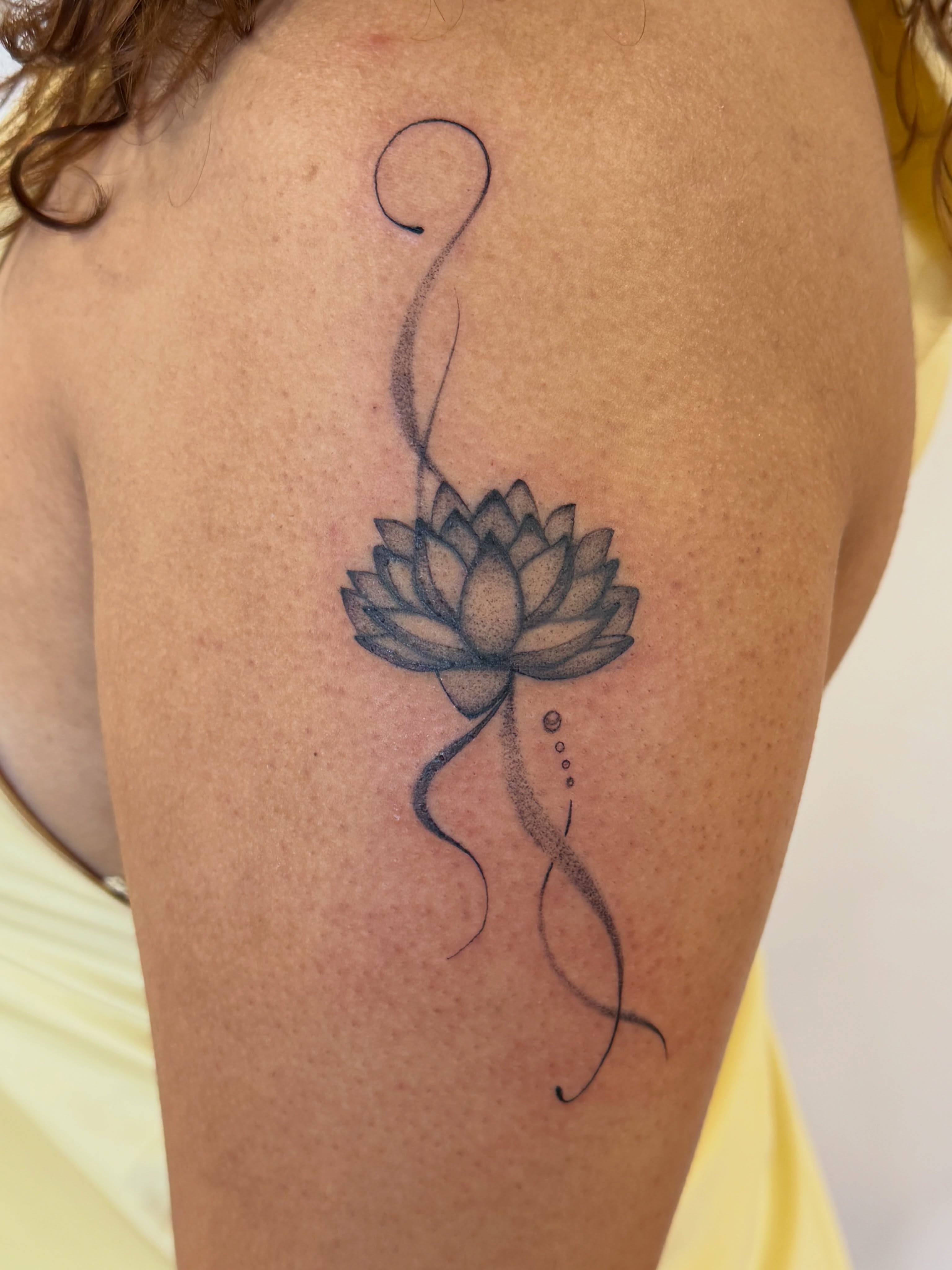 Lotus flower dotwork tattoo on the shoulder by Sienna (jj) Hicks