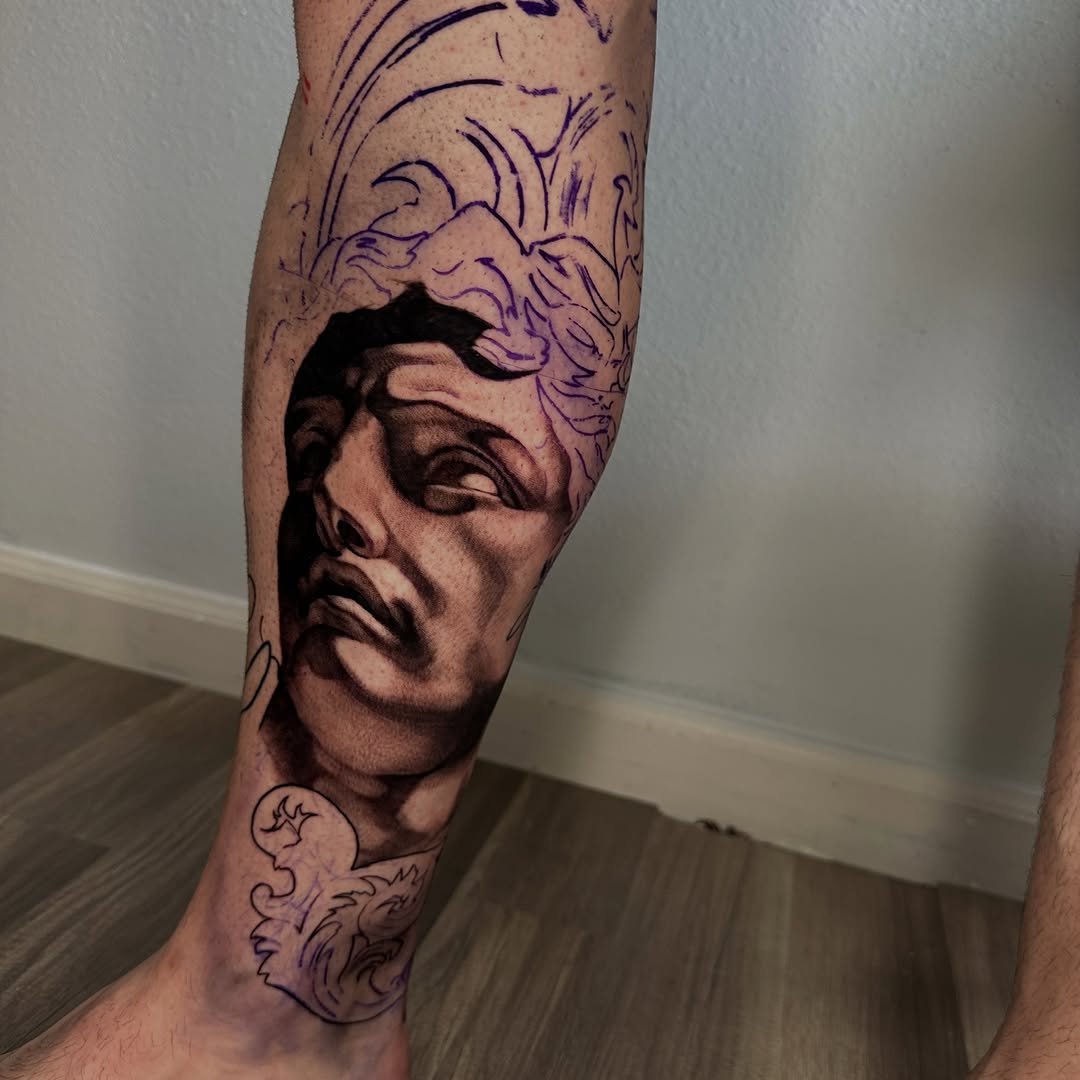 Classical sculpture portrait surrealism tattoo on the forearm by Trent Hebert