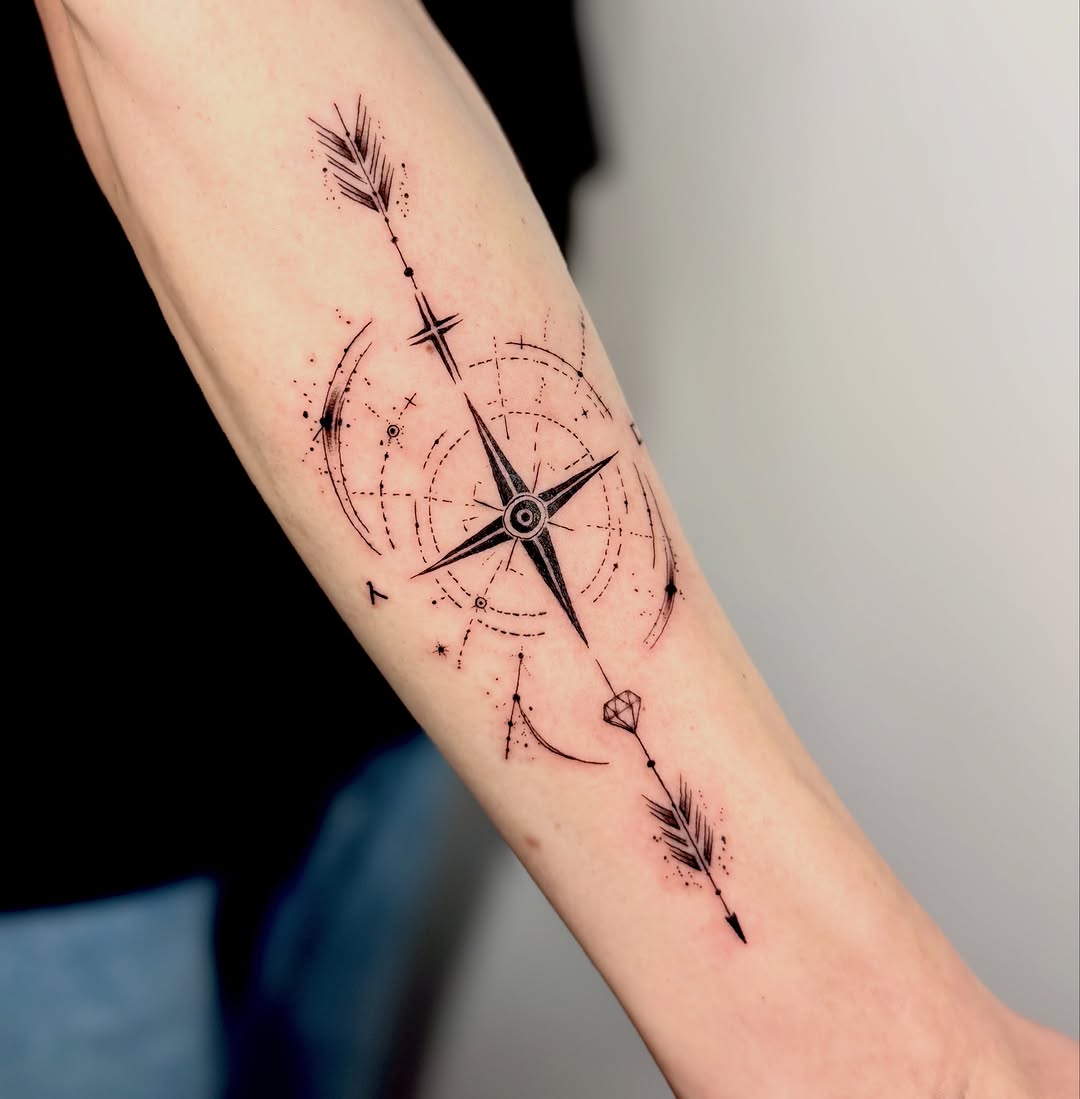 Compass with arrows and diamond geometric tattoo on the forearm by Orca