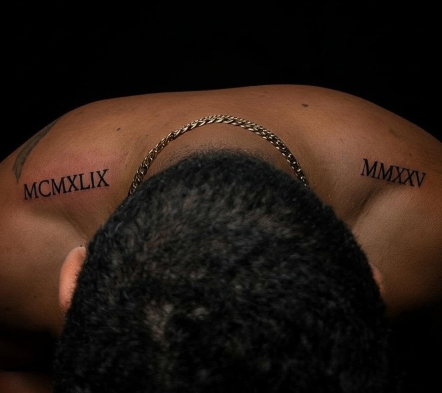 Roman numerals black and grey tattoo on the chest by Tony