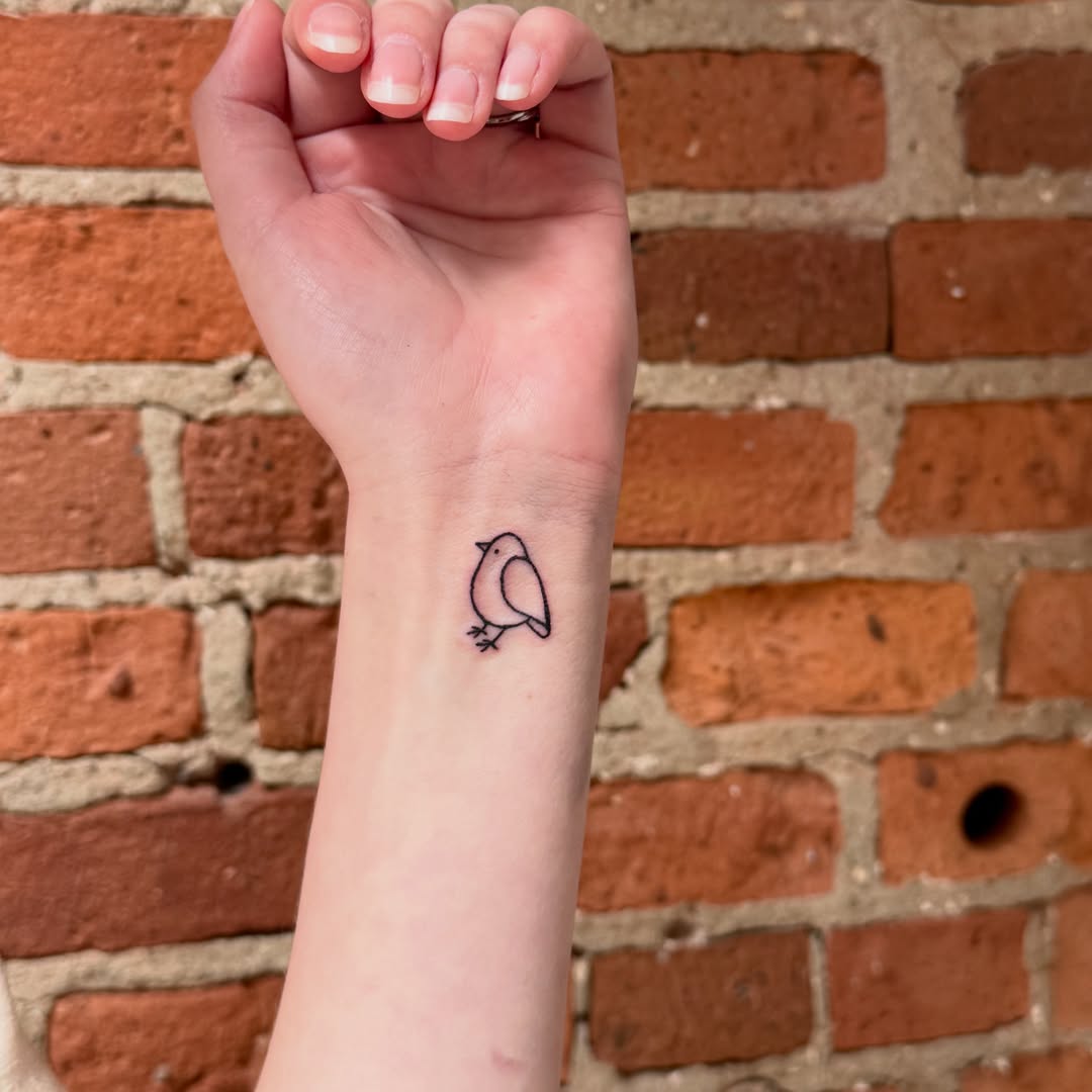 Bird minimalist tattoo by Caroline at Lettie Grace Ink