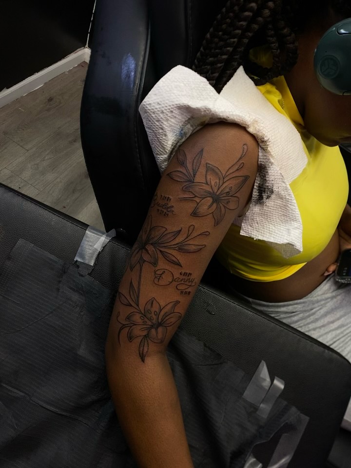 Lily flowers black and grey tattoo on the forearm by Mariš¤, Chicago, Illinois