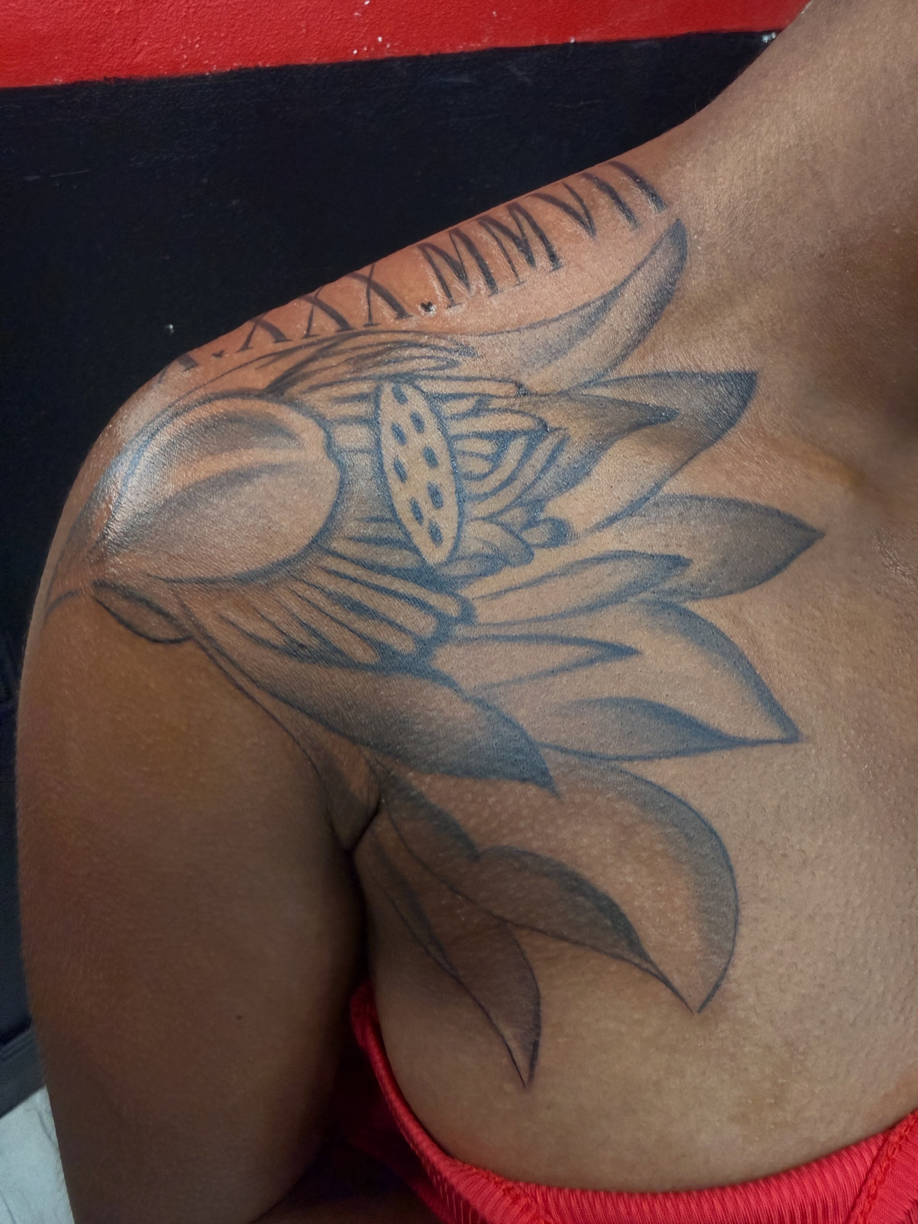 Lotus flower black and grey tattoo on the shoulder by Betotats