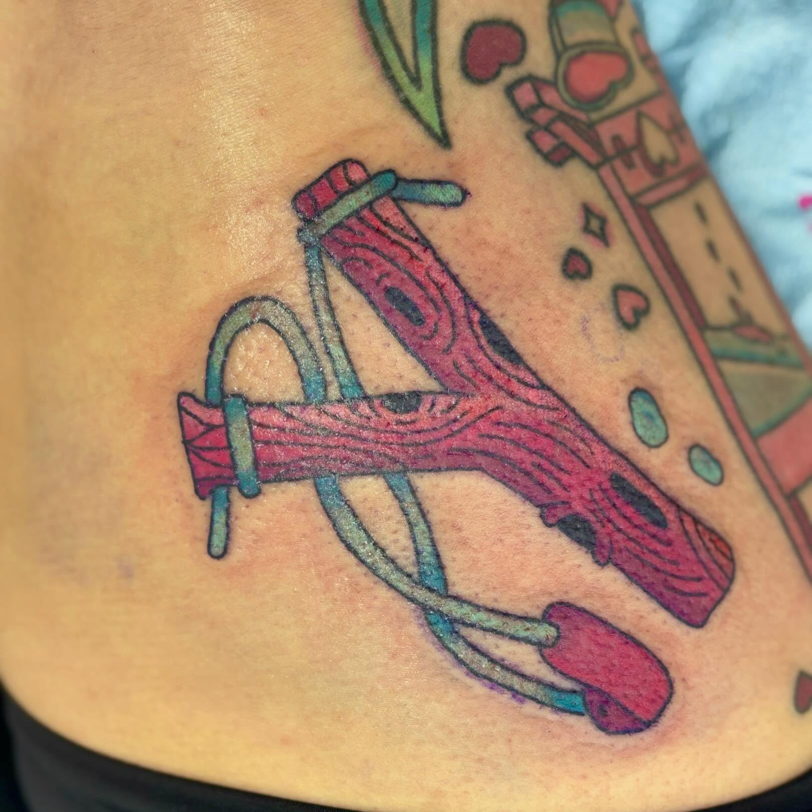 Wooden sled American traditional tattoo on the thigh by Taylor  Thompson