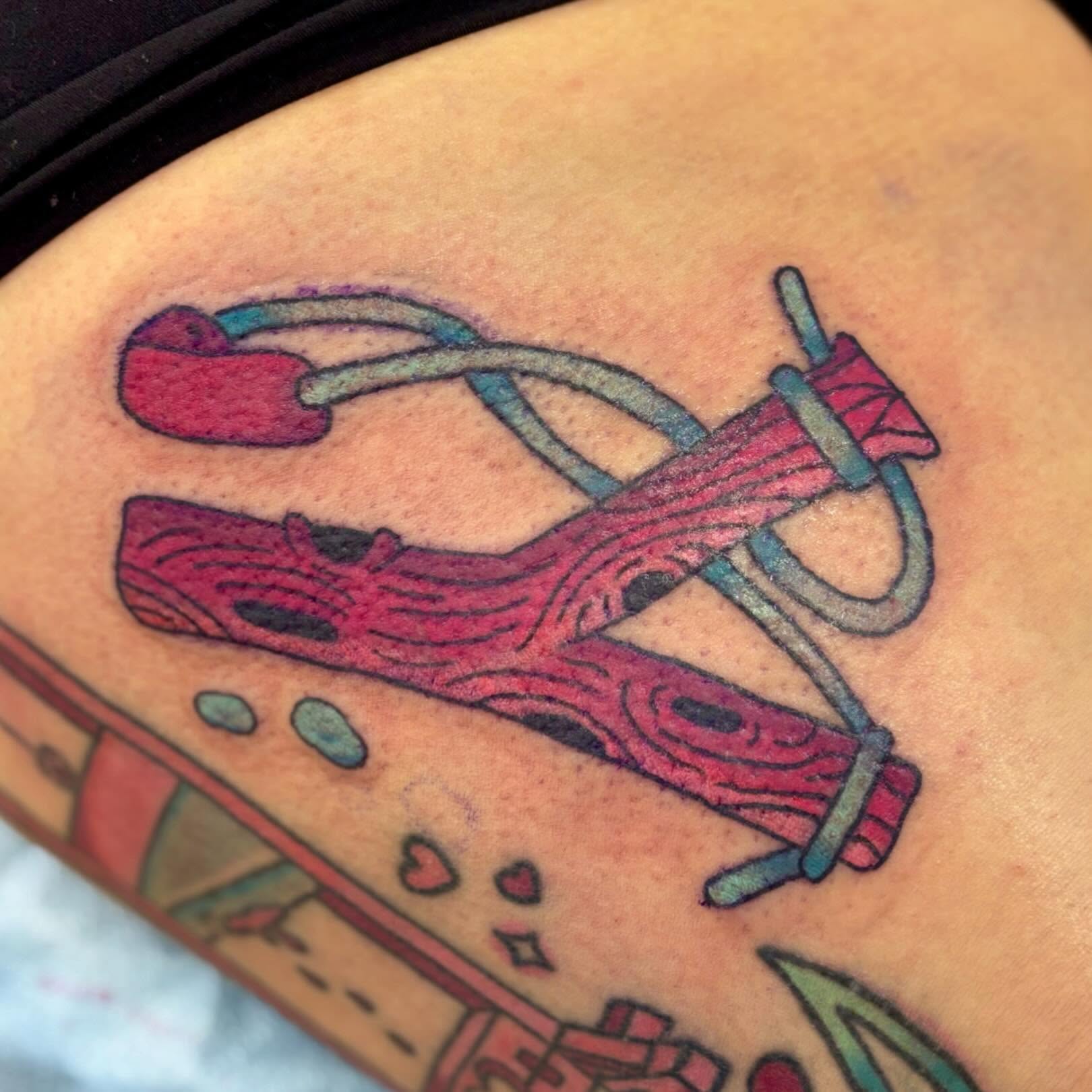 Bow and arrow American traditional tattoo on the upper arm by Taylor  Thompson