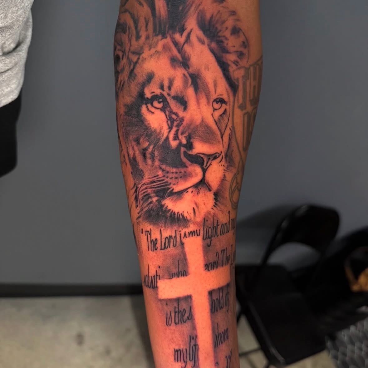 Lion realism tattoo on the forearm by Butta