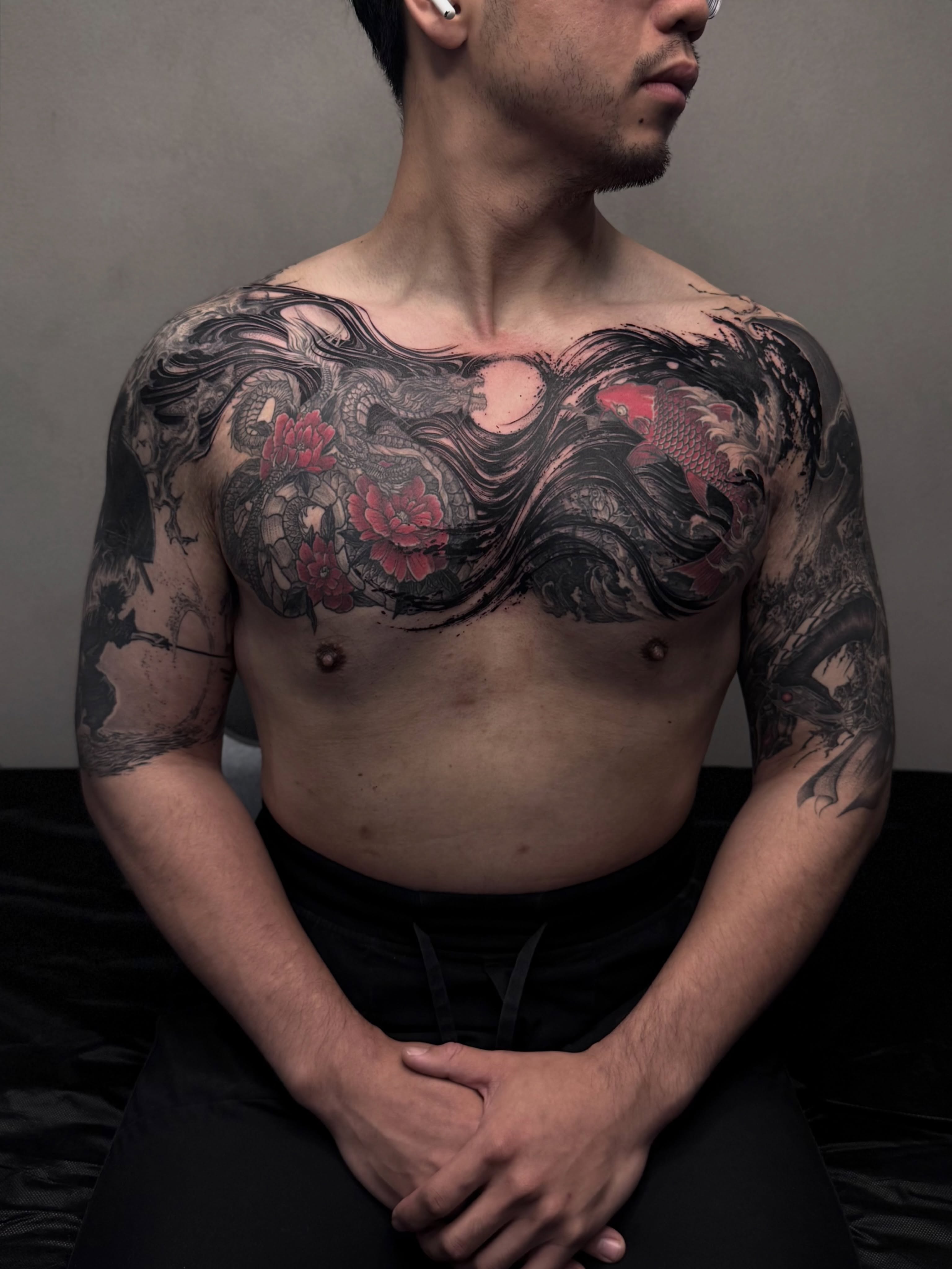 Dragon and koi fish japanese irezumi tattoo on the chest by Vold