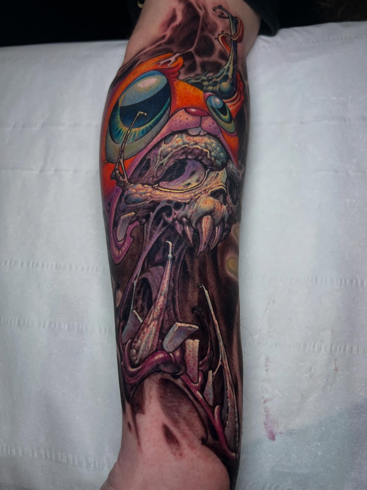 Cyborg skull dark realism tattoo on the forearm by Jesse Smith