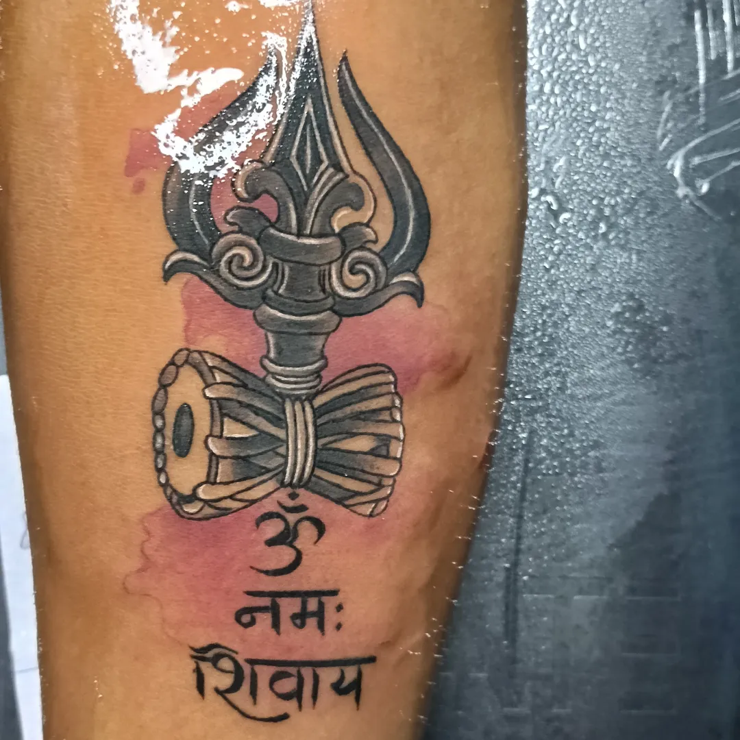 Trident and drum ornamental tattoo on the forearm by VR tattoo Studio