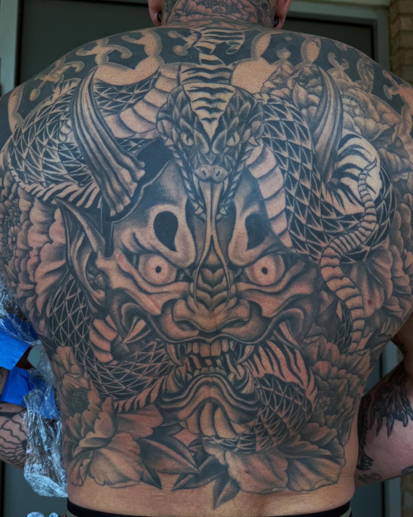 Demon mask japanese irezumi tattoo on the back by Jesse Gray