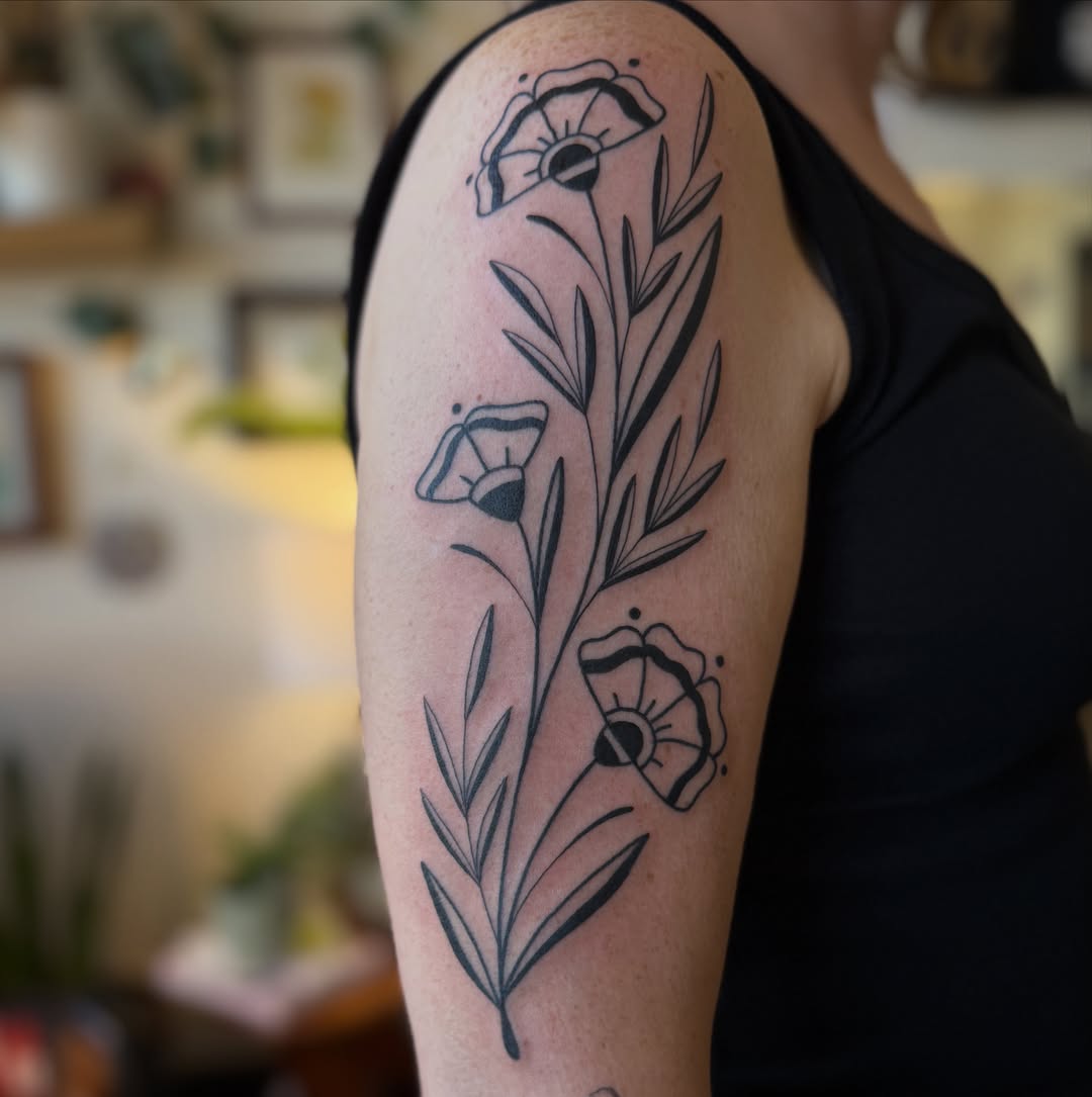 Poppy flowers black and grey tattoo on the forearm by Leah - Tattoo Artist