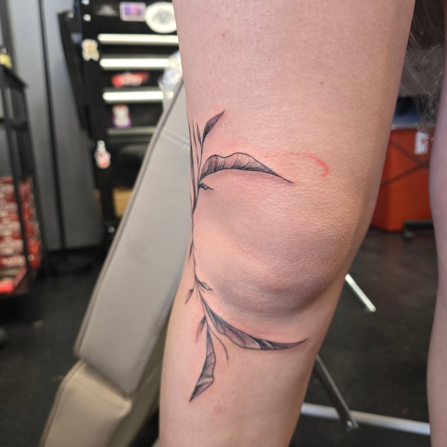 Feather black and grey tattoo on the forearm by Maddox Kitson🕷