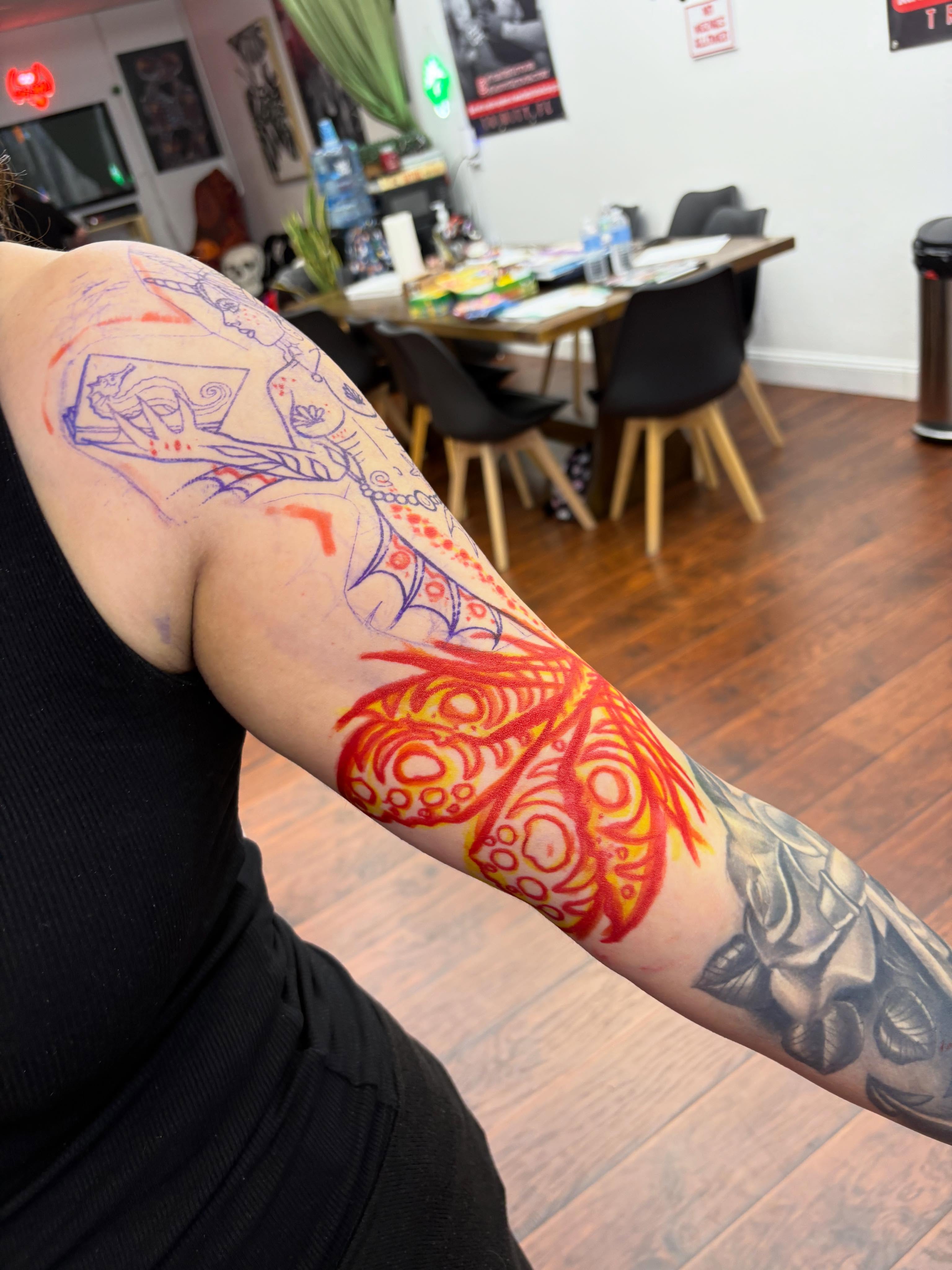 Flame and dragon new school tattoo on the forearm by Skye California