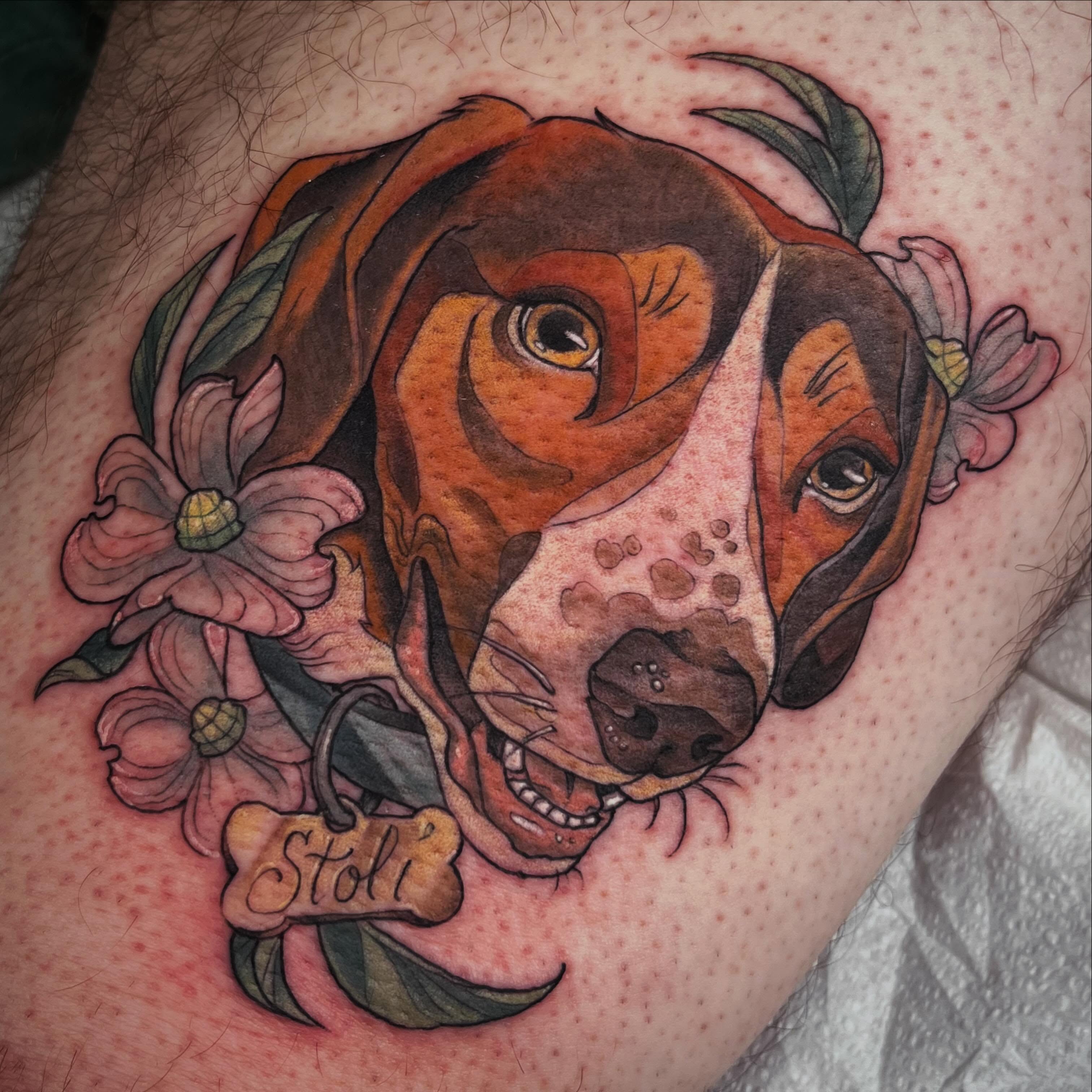 Dog with flowers realism tattoo on the thigh by Cassandra