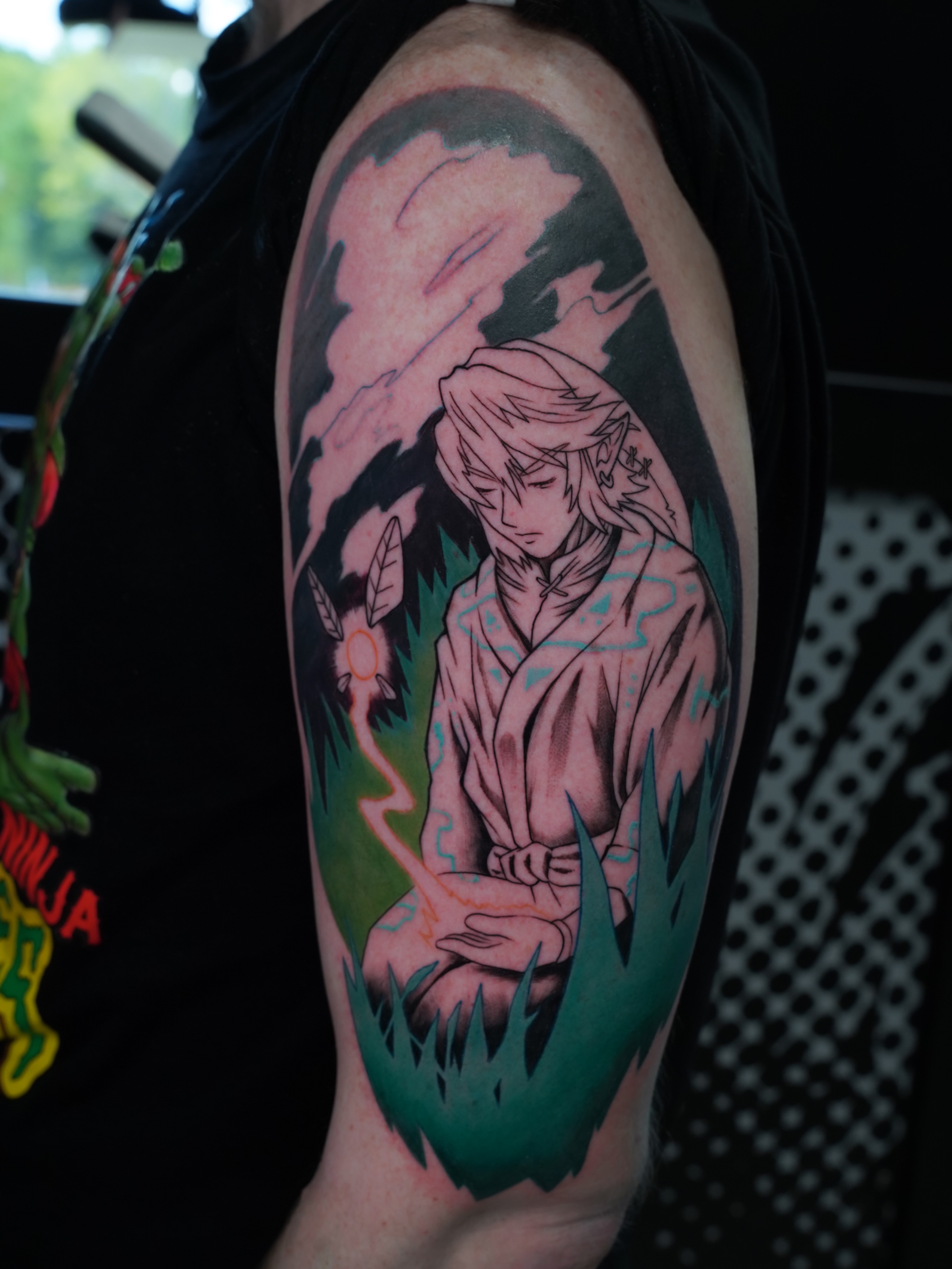 Anime character anime tattoo on the upper arm by Derek Foferek, Charlotte, North Carolina