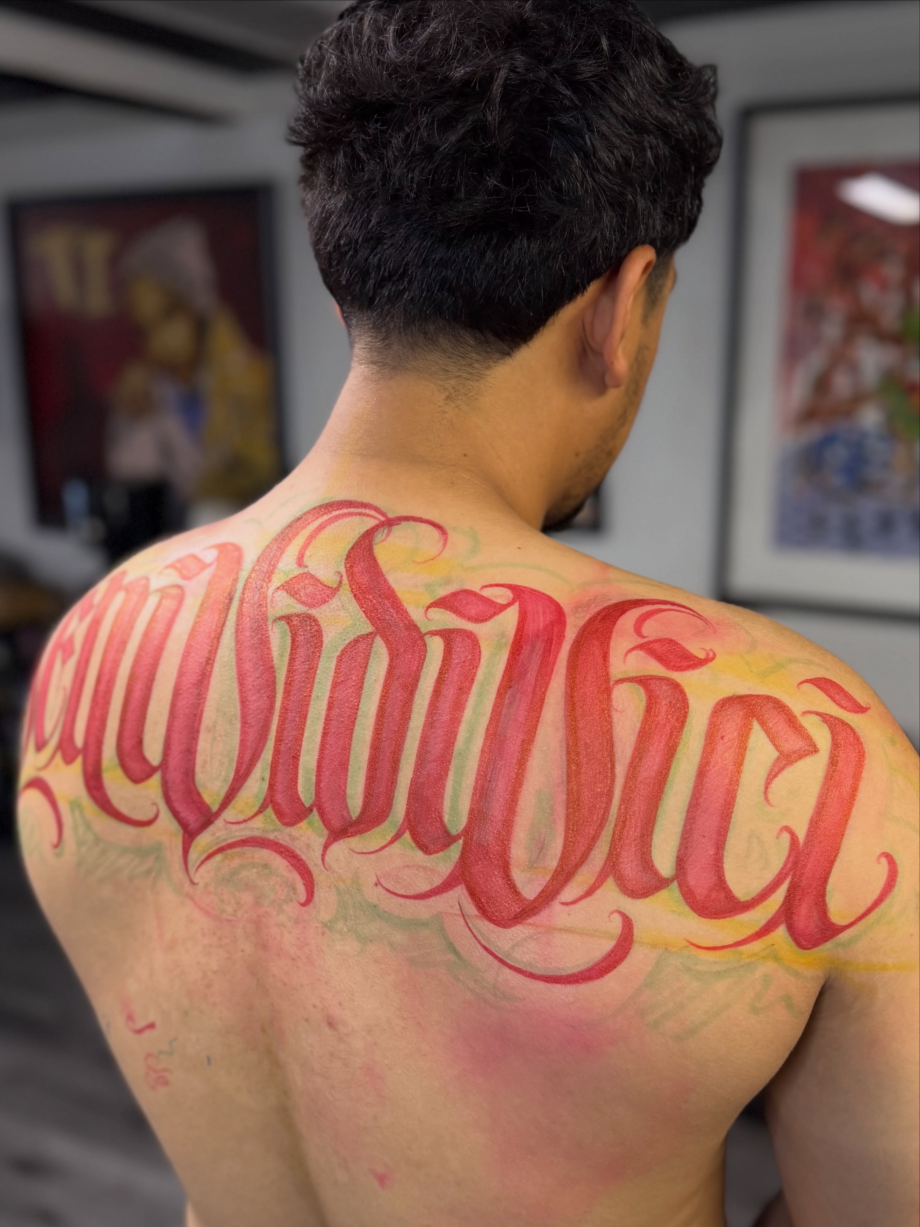 Script lettering lettering script tattoo on the back by Rocky G Inkz LLC