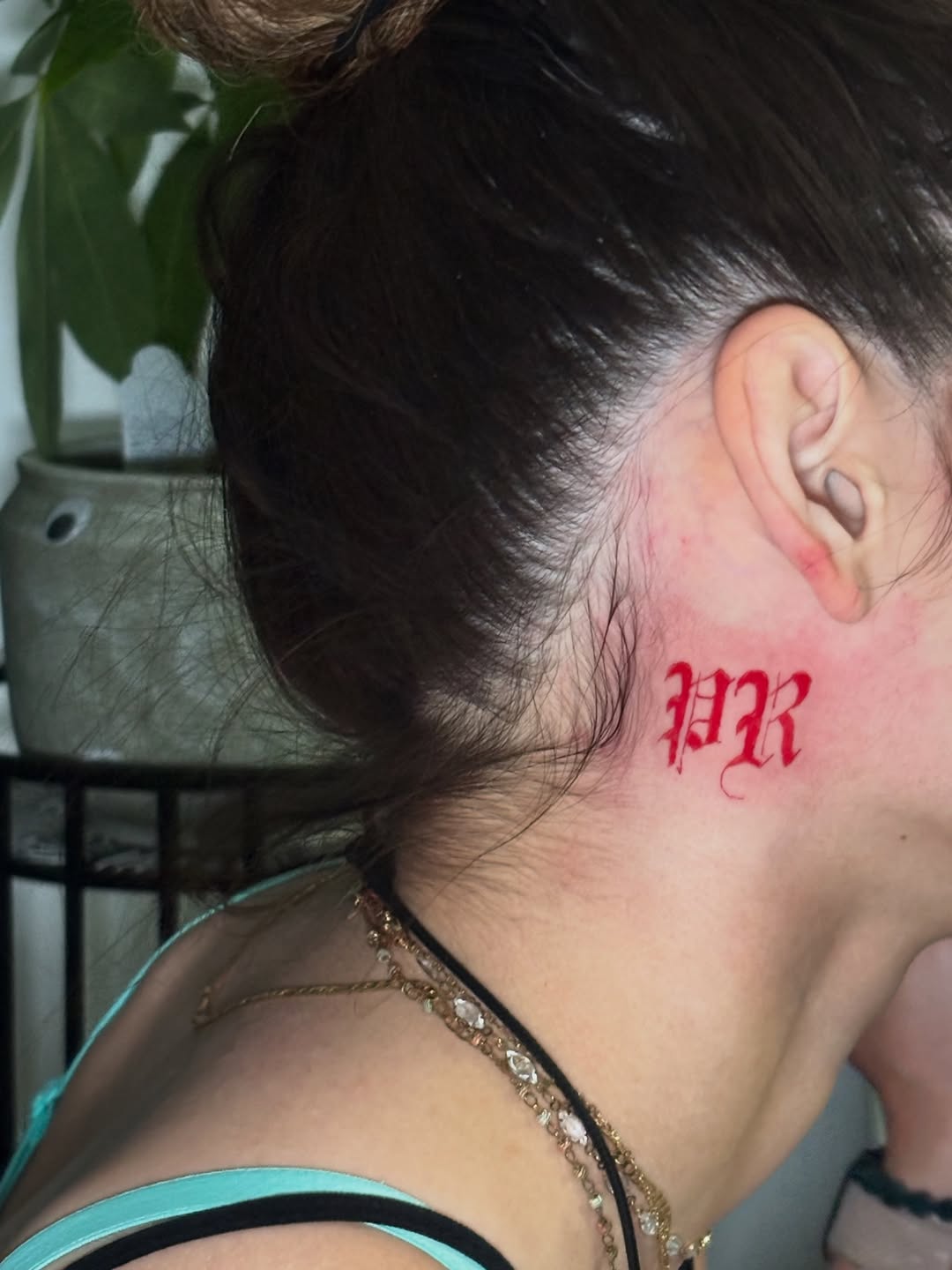 Gothic lettering lettering tattoo on the neck by Lopez Dautruche